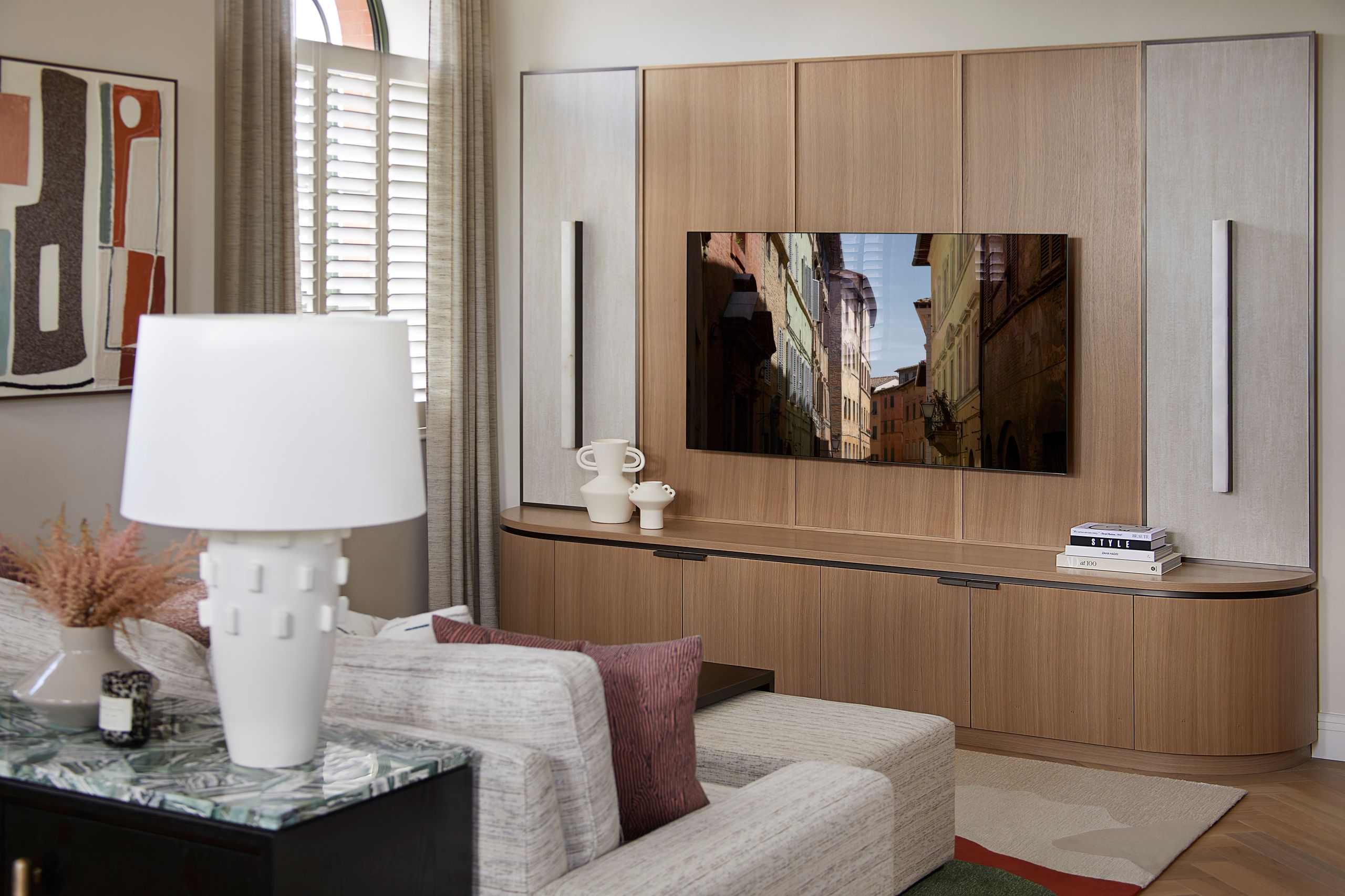 Image may contain: Indoors, Interior Design, Lamp, Table Lamp, Architecture, Building, Furniture, Living Room, and Room