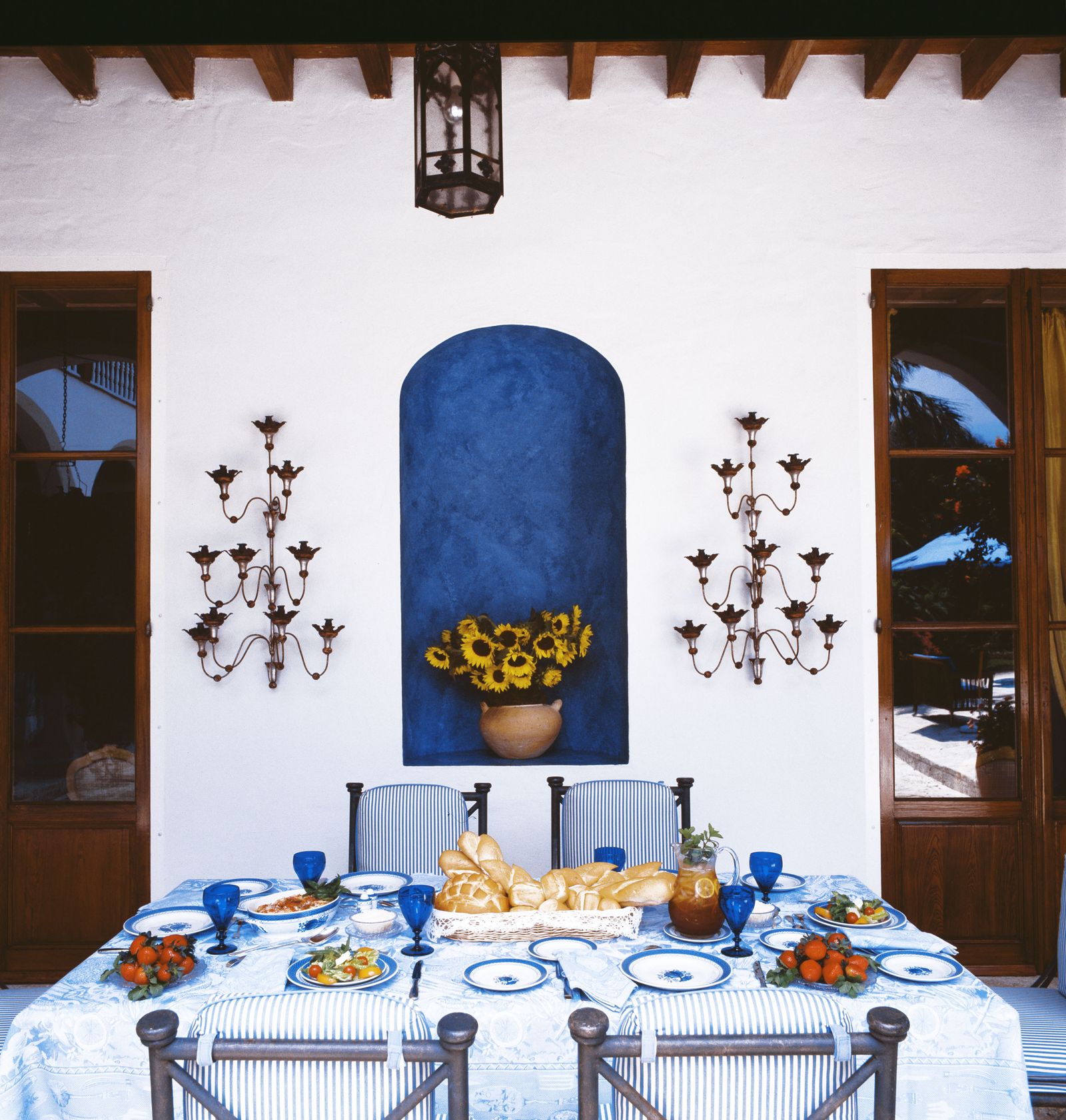 Image may contain Dining Table Furniture Table Architecture Building Dining Room Indoors Room Tablecloth and Chair