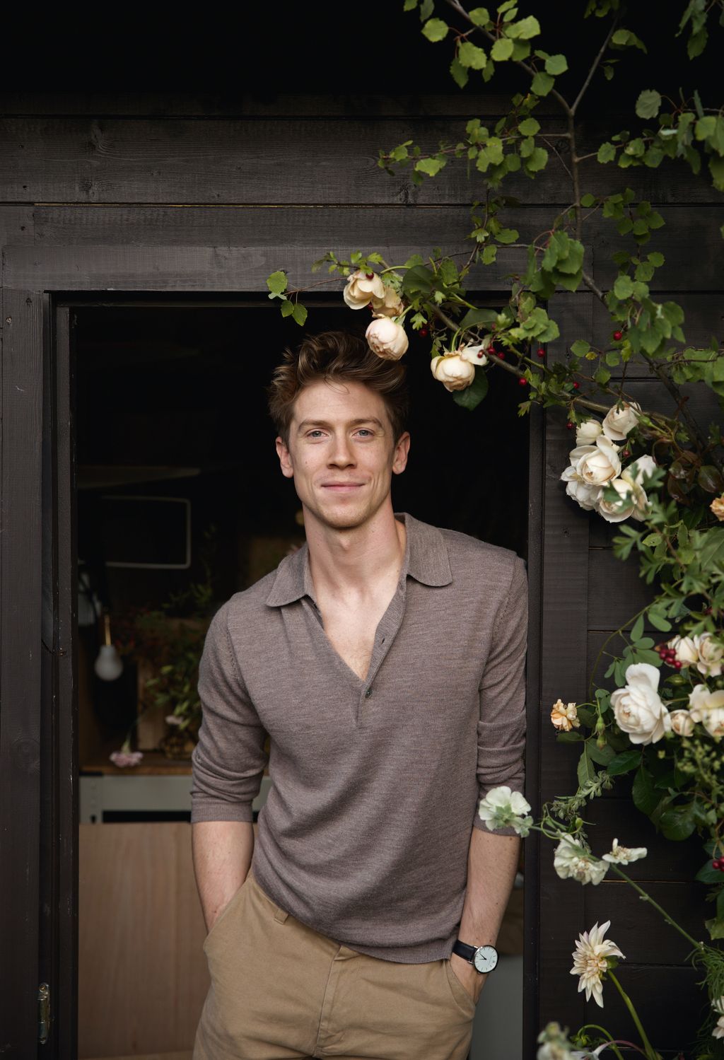 Image may contain Matt Austin Face Head Person Photography Portrait Plant Potted Plant Flower Rose and Wristwatch