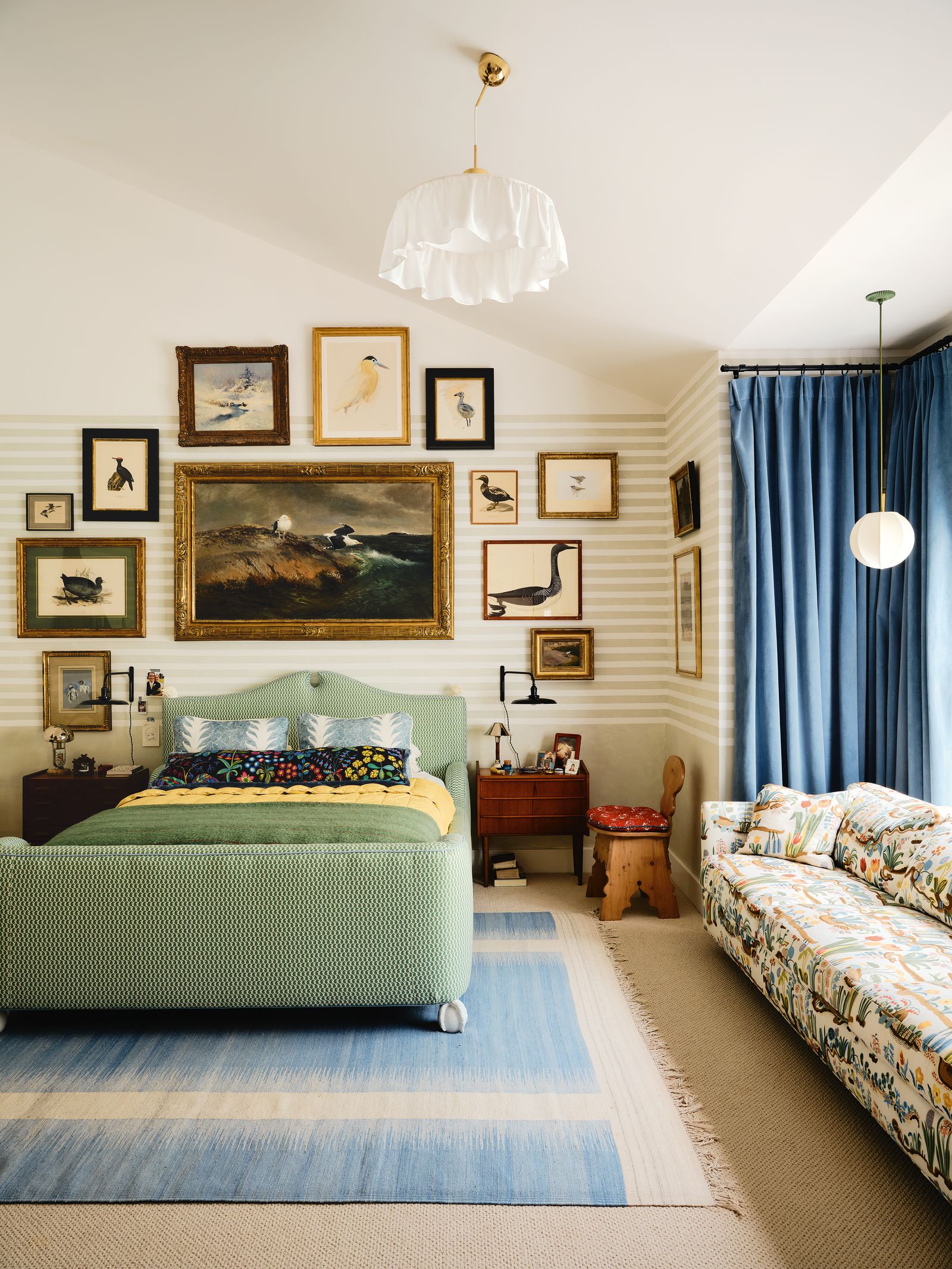 Image may contain Home Decor Lamp Bed Furniture Chair Couch Rug Art Painting Indoors Interior Design and Bedroom