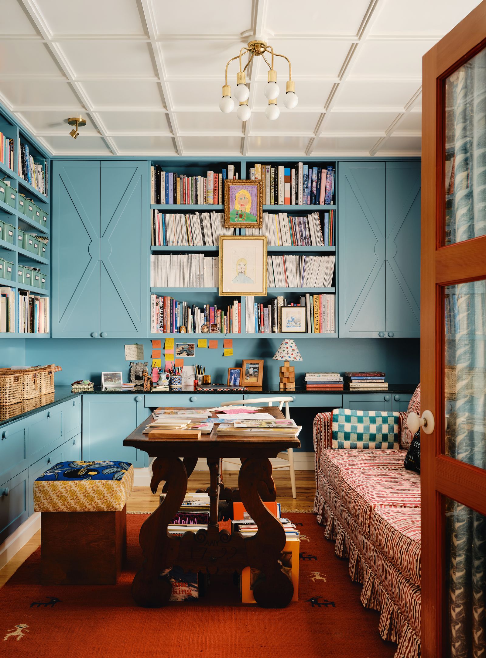 Image may contain Furniture Lamp Art Painting Bookcase Desk Table Home Decor Rug Indoors and Interior Design