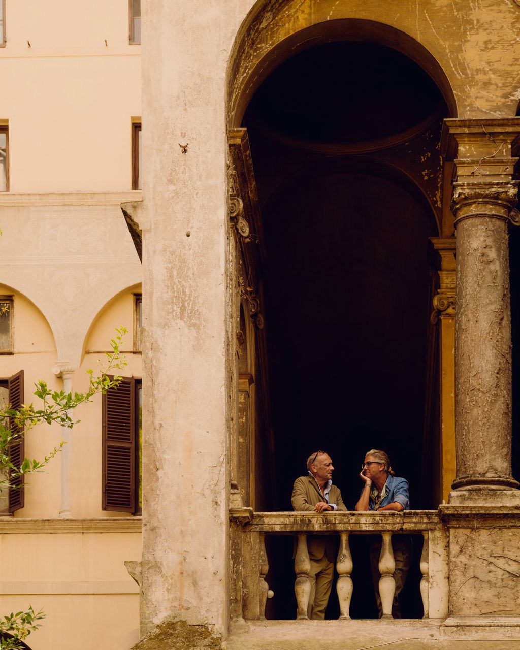 Image may contain Norbert Gastell Adult Person Arch Architecture Balcony Building Accessories and Glasses