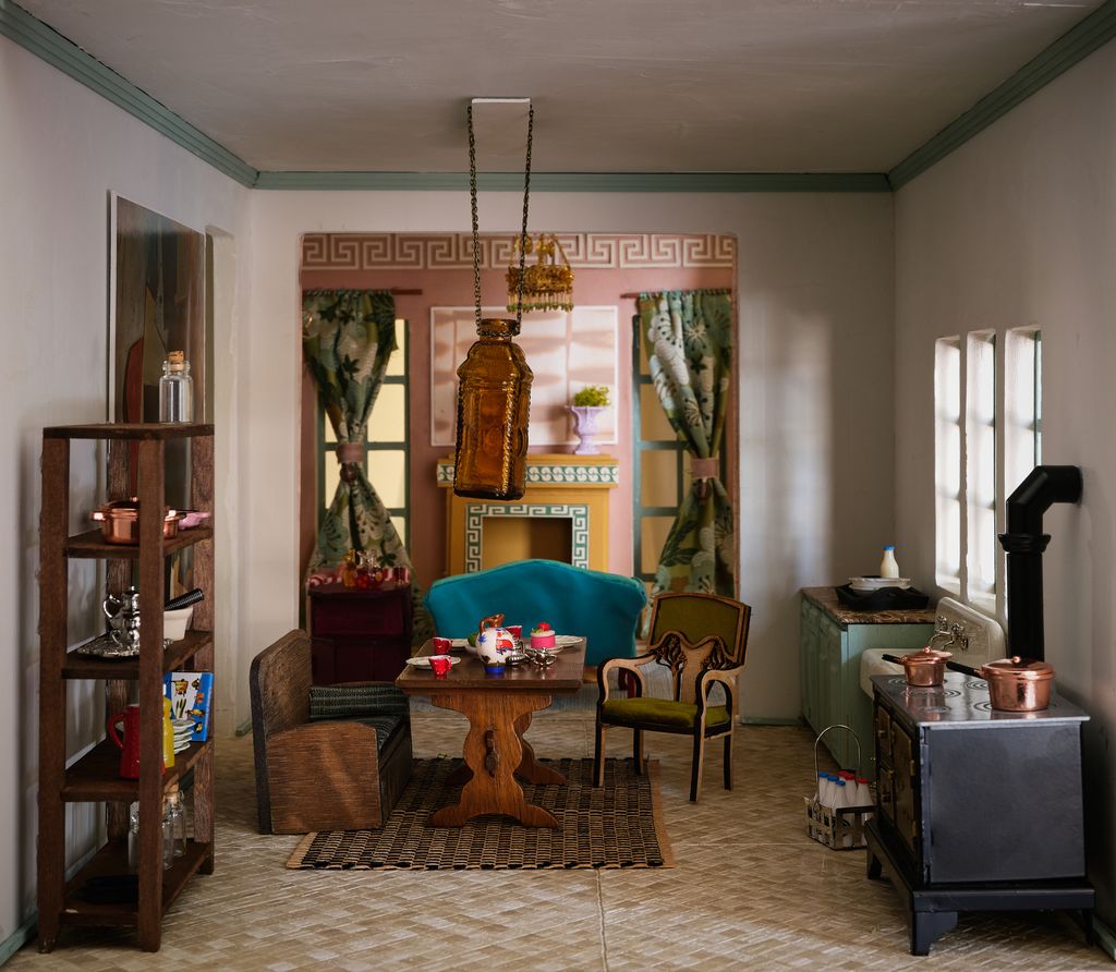 Image may contain Architecture Building Furniture Indoors Living Room Room Home Decor Chair Rug and Dining Room