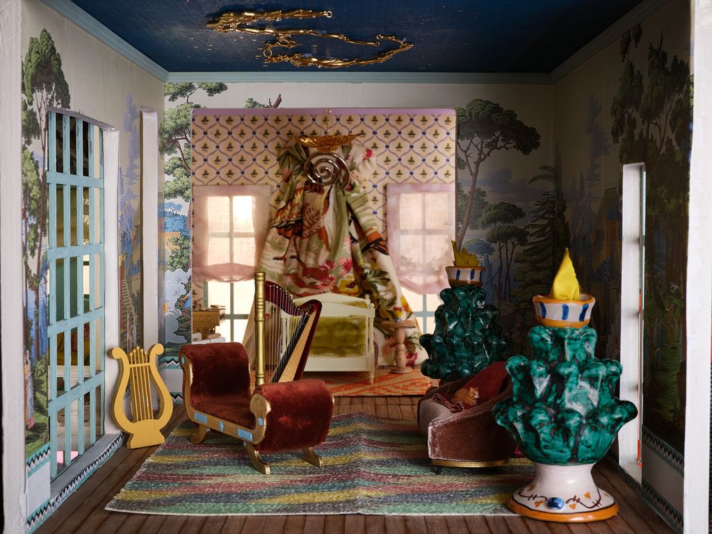 Image may contain Home Decor Chair Furniture Rug Person Architecture Building Indoors Living Room and Room