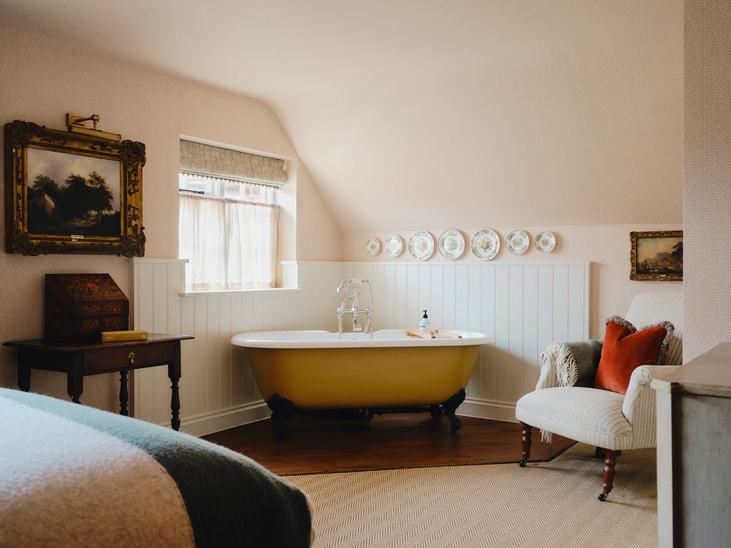 Image may contain Bathing Art Painting Bathtub Person Tub Desk Furniture Table Home Decor Chair and Sink