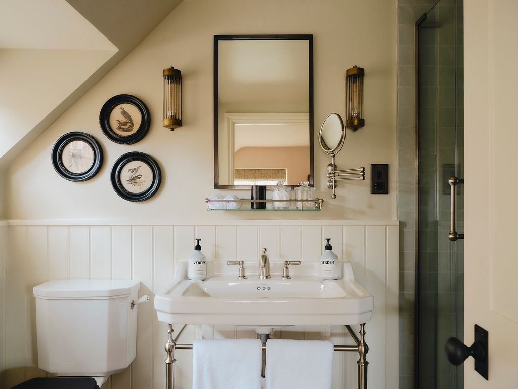 Image may contain Lamp Sink Sink Faucet Bathroom Indoors Room Toilet Art and Painting