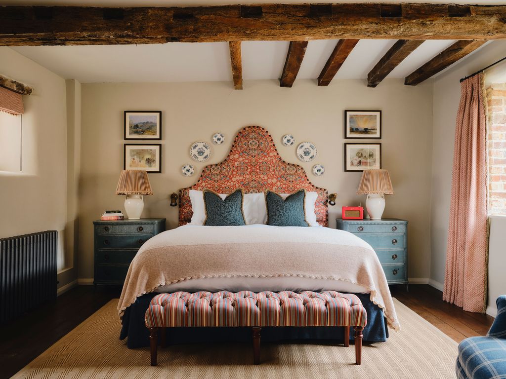 Image may contain Indoors Interior Design Home Decor Lamp Bed Furniture Rug Cushion Art Painting and Bench