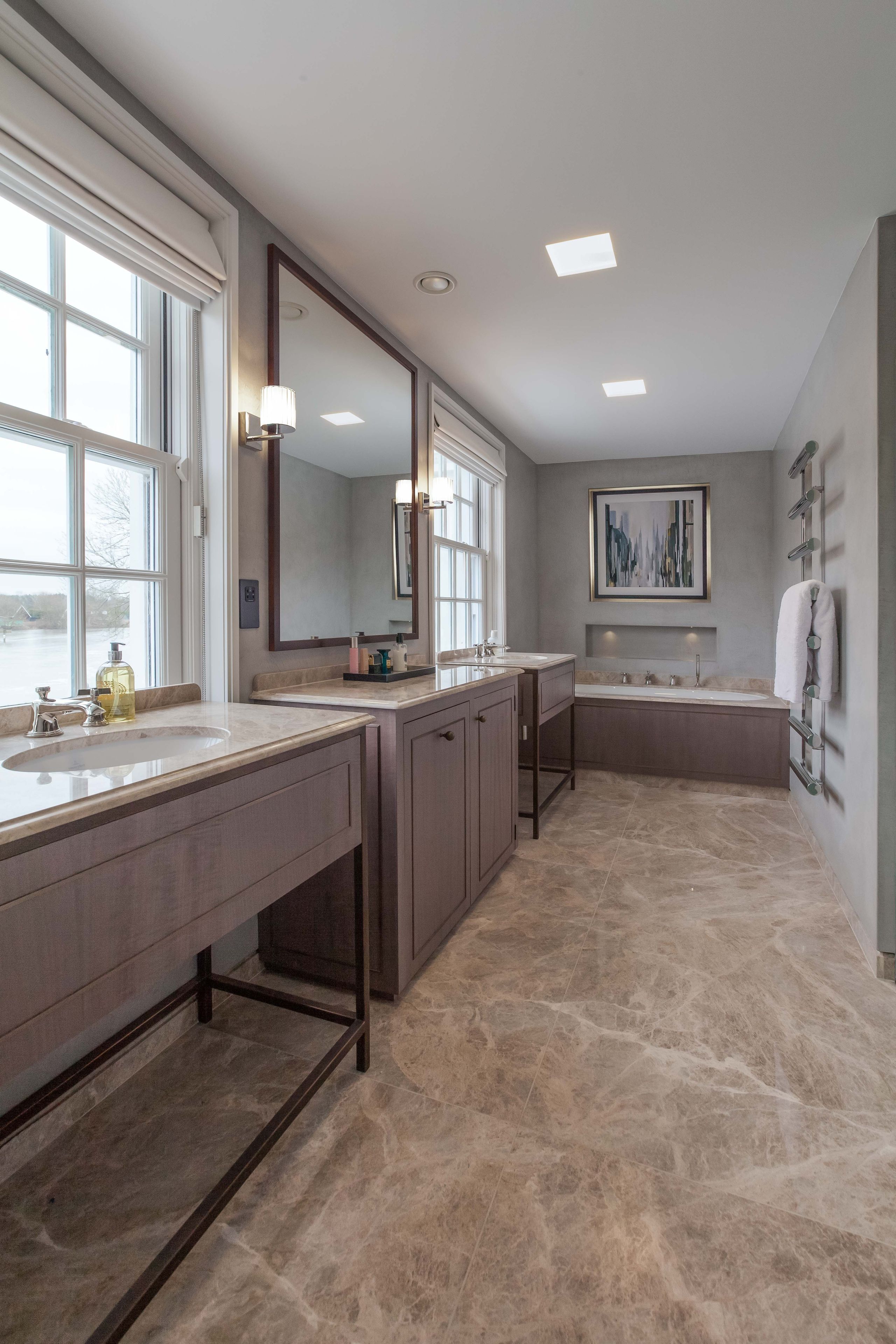 Image may contain: Floor, Flooring, Sink, Lamp, Art, Painting, Indoors, Interior Design, Bathing, Bathtub, Person, and Tub