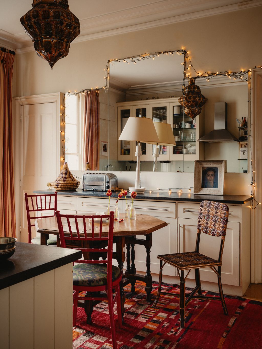 Image may contain Lamp Home Decor Chair Furniture Indoors Interior Design Architecture Building and Dining Room