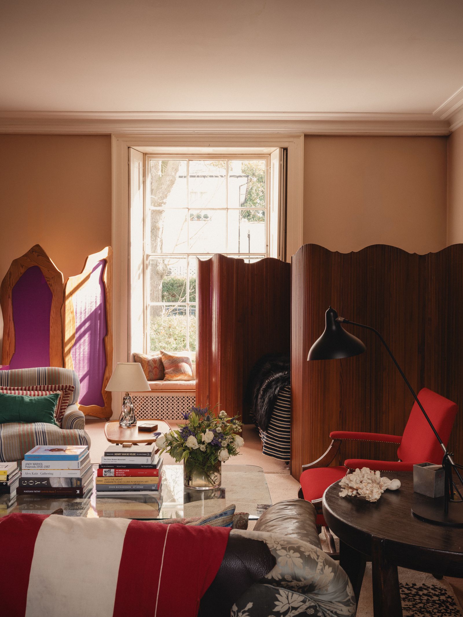 Image may contain Indoors Interior Design Lamp Architecture Building Furniture Living Room Room Desk and Table