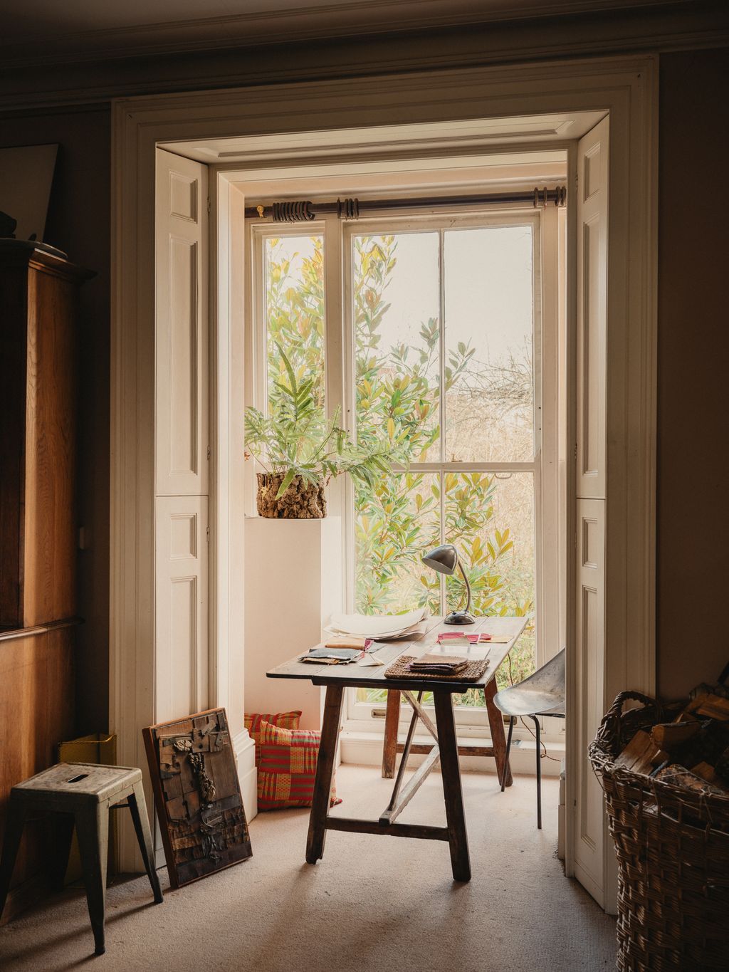 Image may contain Desk Furniture Table Lamp Chair Window and Bay Window