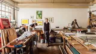 Image may contain Architecture Building Factory Manufacturing Workshop Person Adult Clothing Footwear Shoe and Box