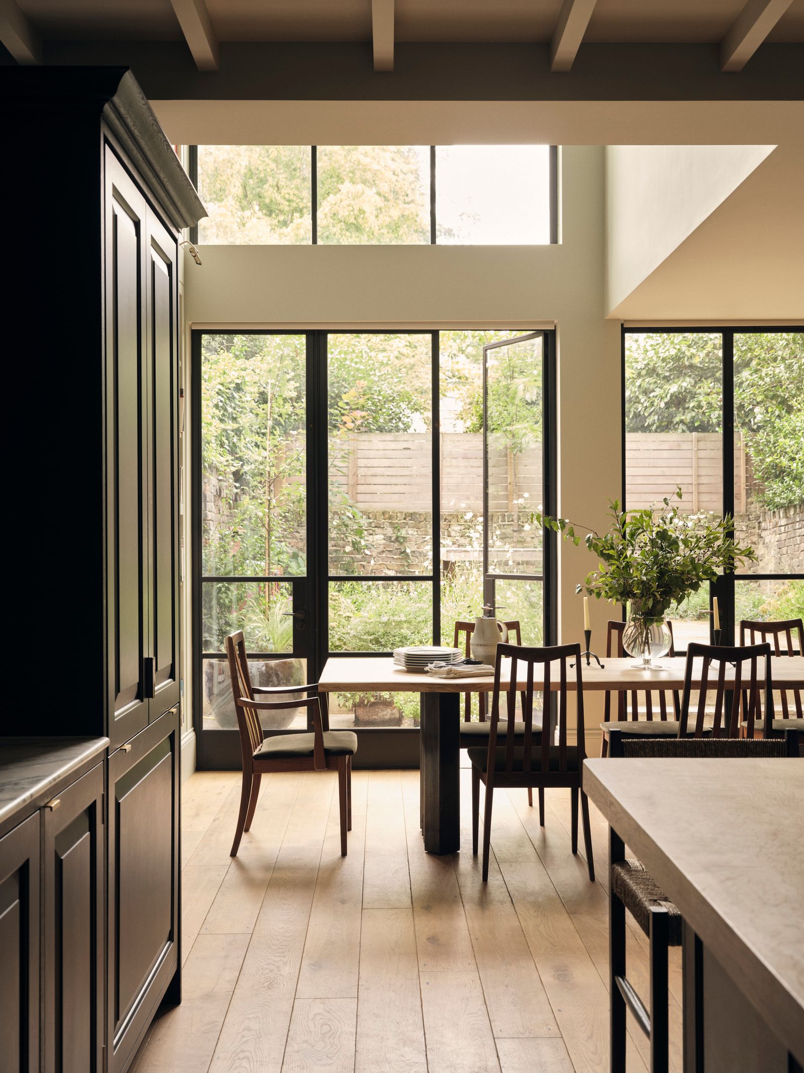 Image may contain Indoors Interior Design Chair Furniture Architecture Building Dining Room Dining Table and Room