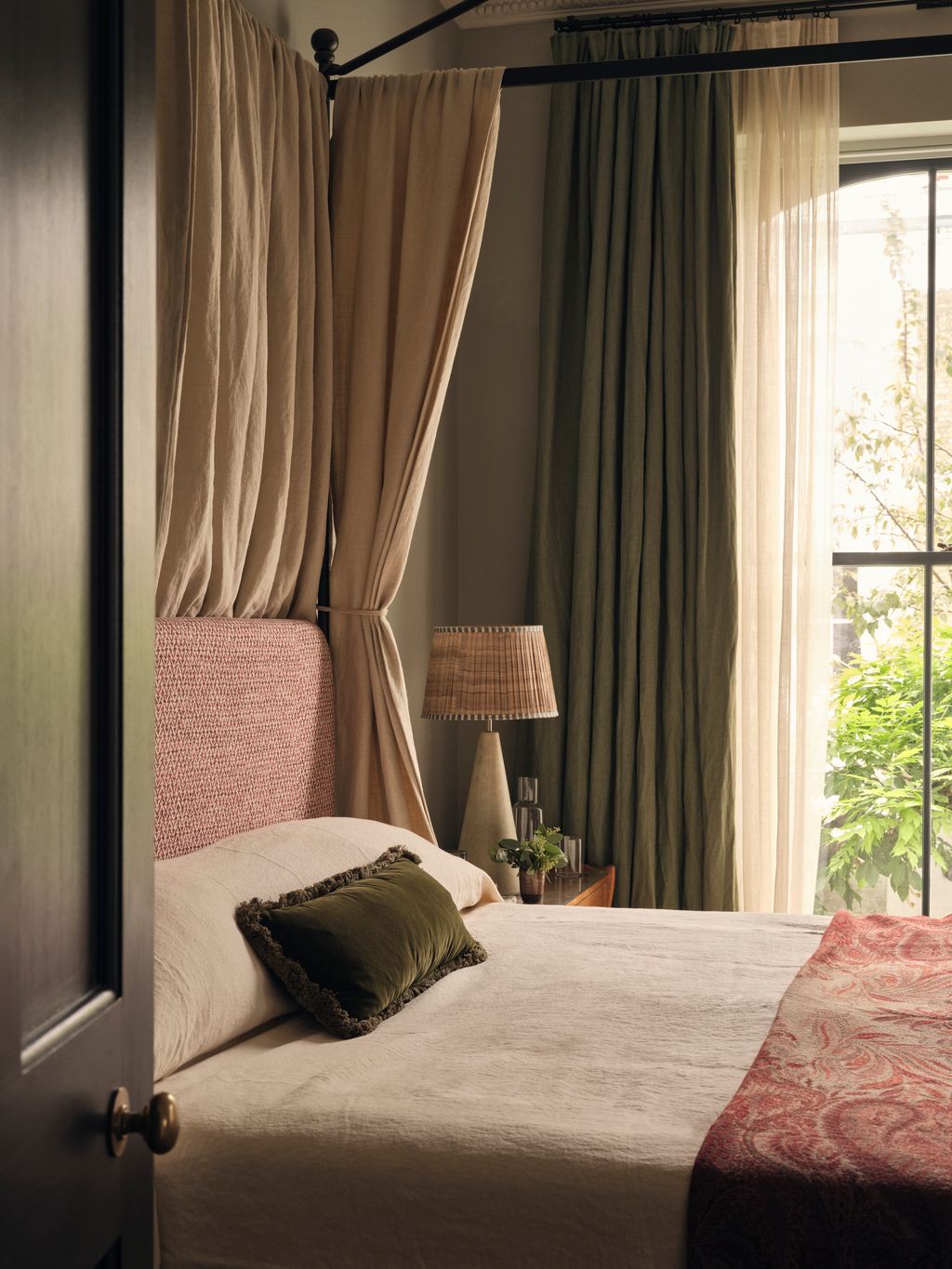 Image may contain Furniture Bed Bedroom Indoors Room Lamp Plant and Canopy Bed