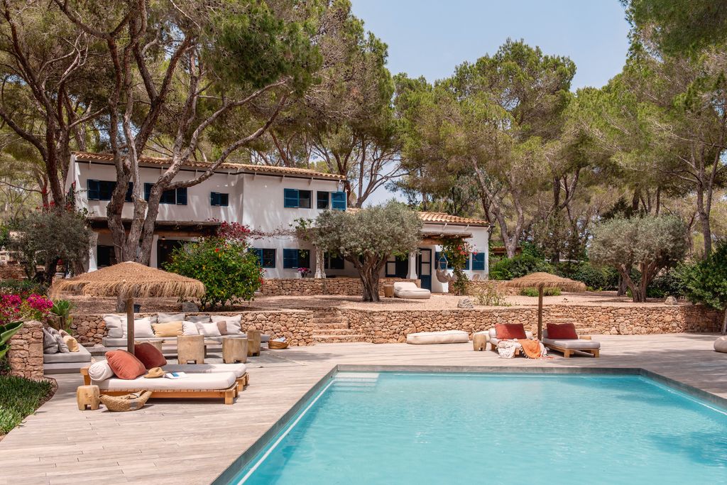 Image may contain Architecture Building House Housing Villa Hotel Resort Chair Furniture Pool Water and Backyard