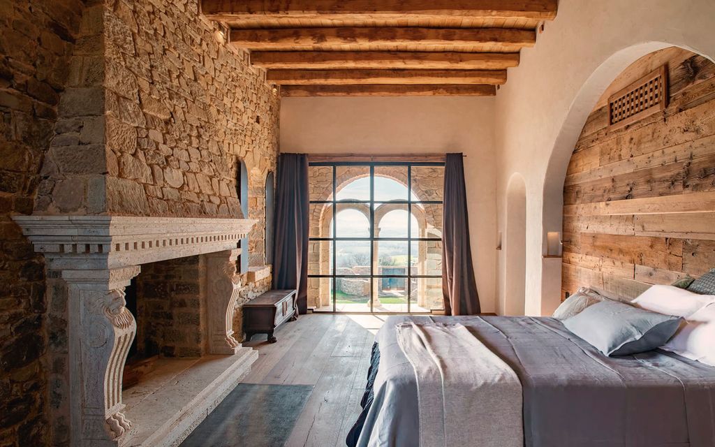 Image may contain Indoors Interior Design Home Decor Bed Furniture Bedroom and Room