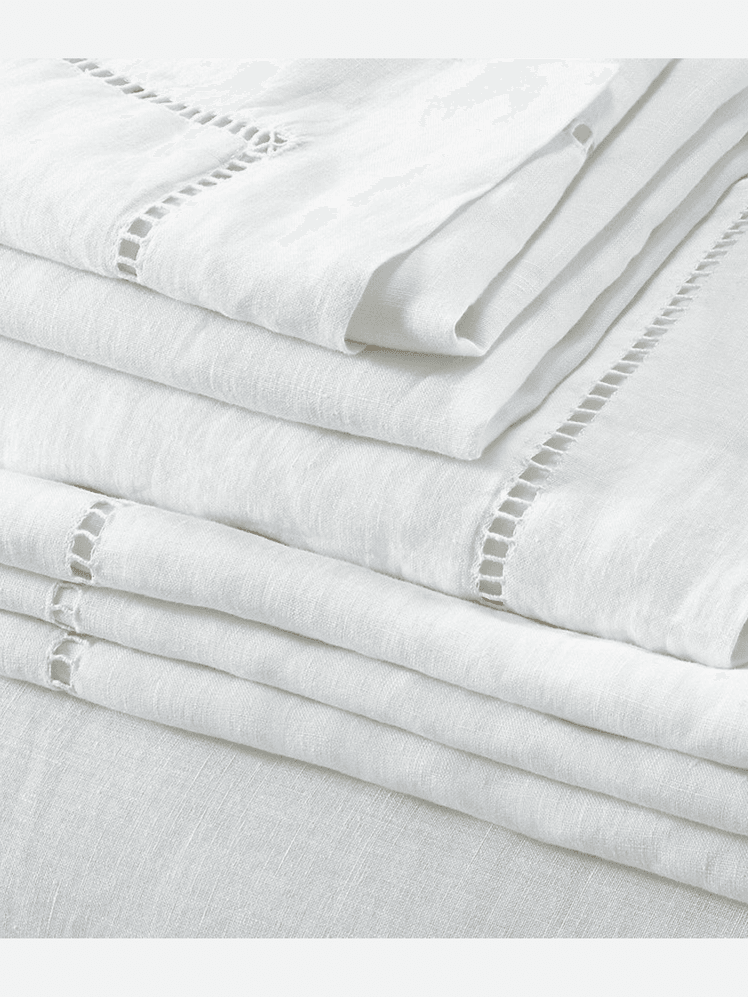 Image may contain Home Decor Linen Blanket Bed and Furniture