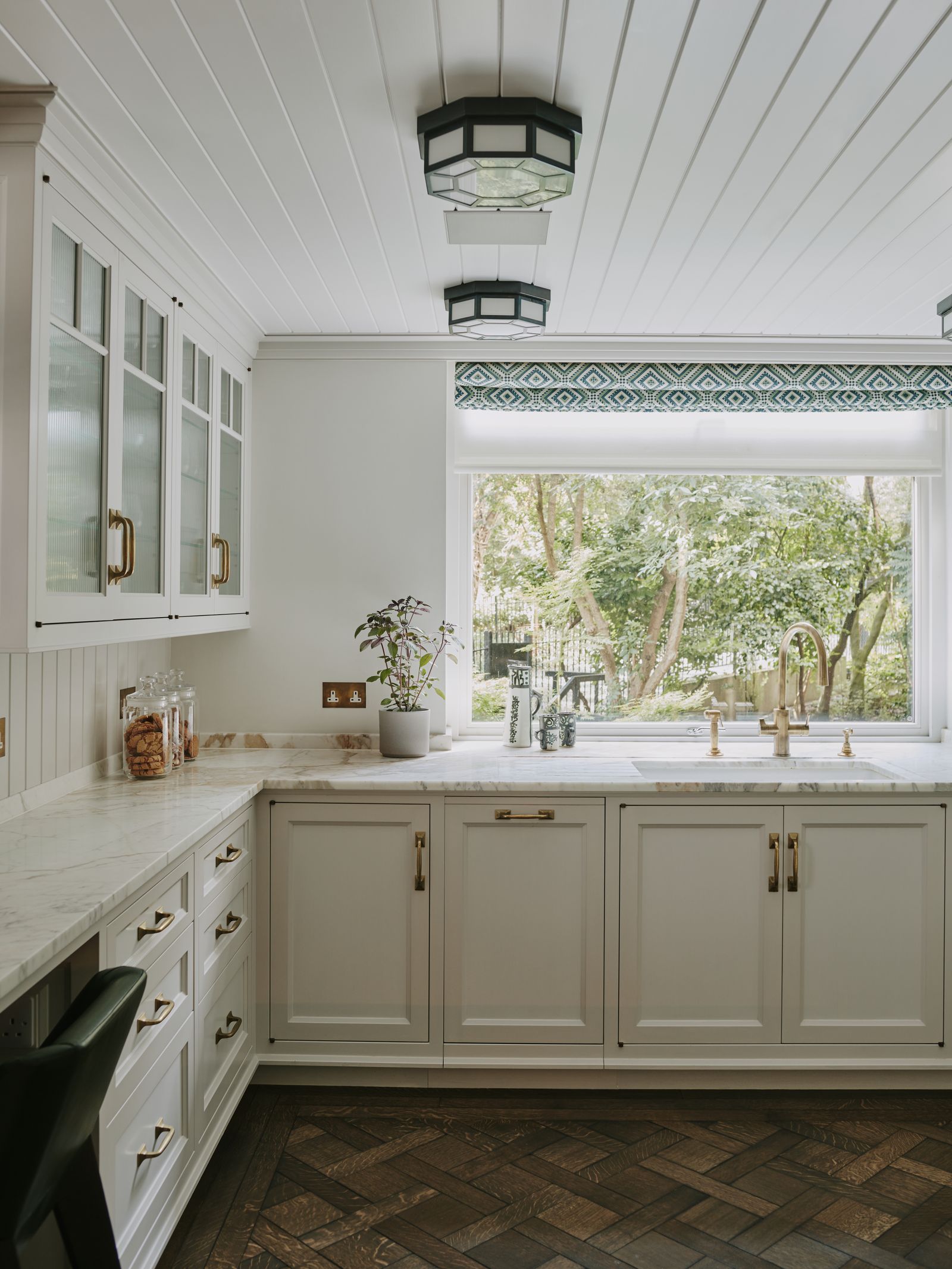 Image may contain Indoors Interior Design Sink Sink Faucet Chair and Furniture