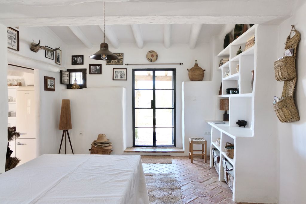 Image may contain Lamp Accessories Bag Handbag Home Decor Door Art Painting Architecture Building Housing and Bed