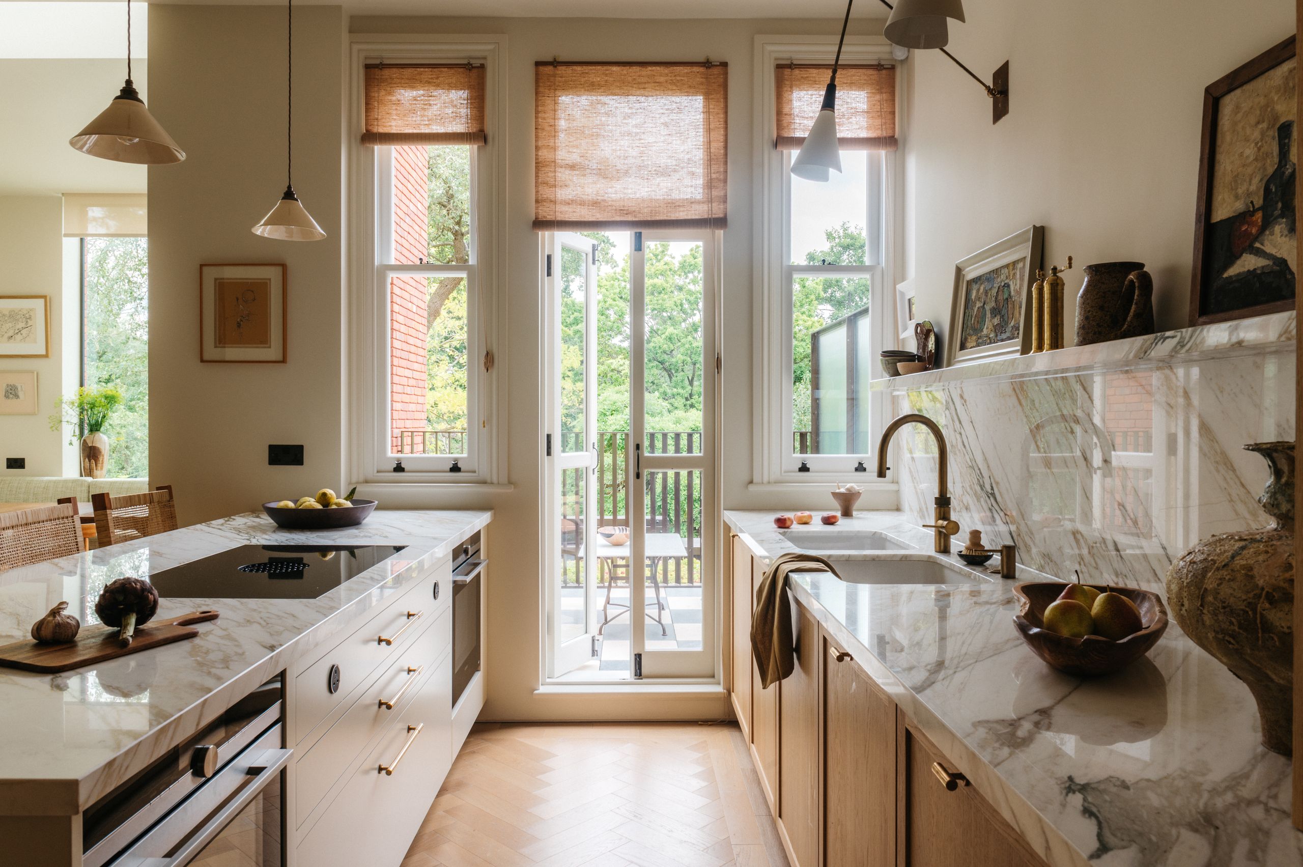 Image may contain: Indoors, Kitchen, Door, Plant, Chair, Furniture, Sink, Sink Faucet, Architecture, Building, and Housing