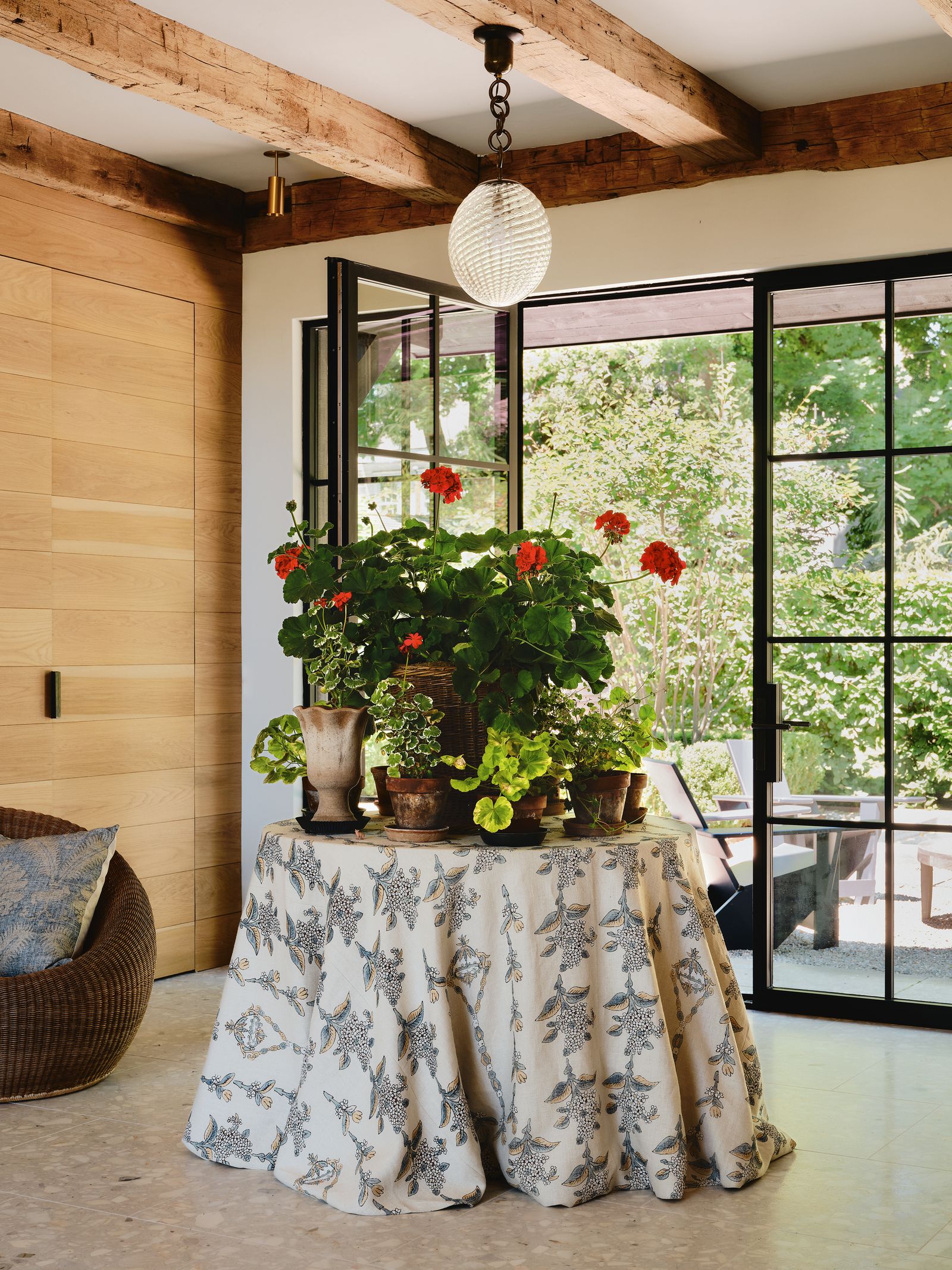 Image may contain Plant Potted Plant Indoors Interior Design Lamp Desk Furniture Table and Flower