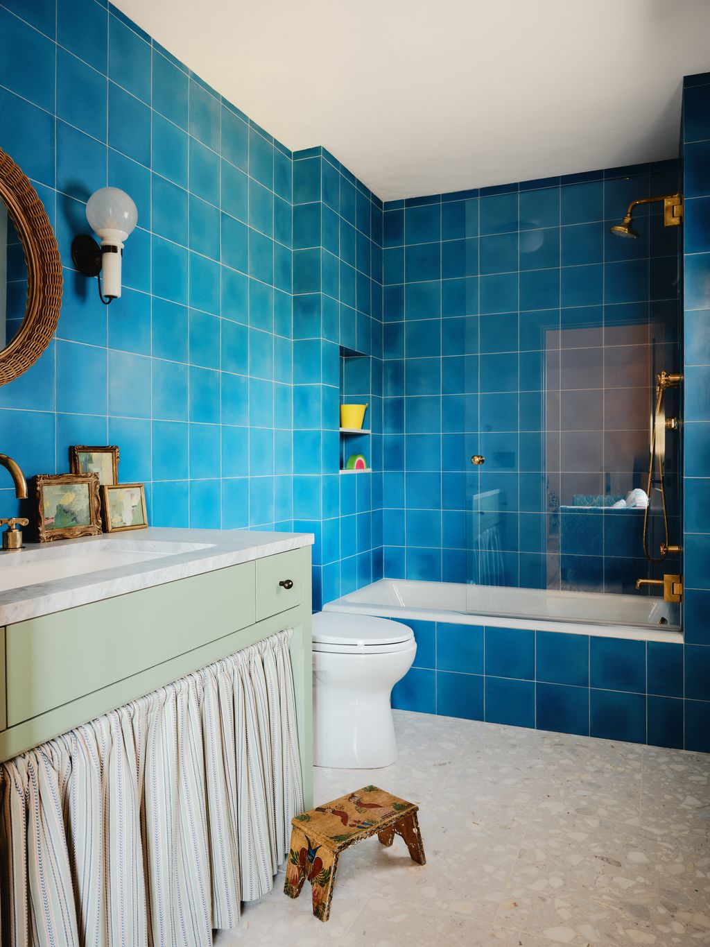 Image may contain Indoors Interior Design Bathing Bathtub Person Tub Art Painting Sink Bathroom Room and Toilet