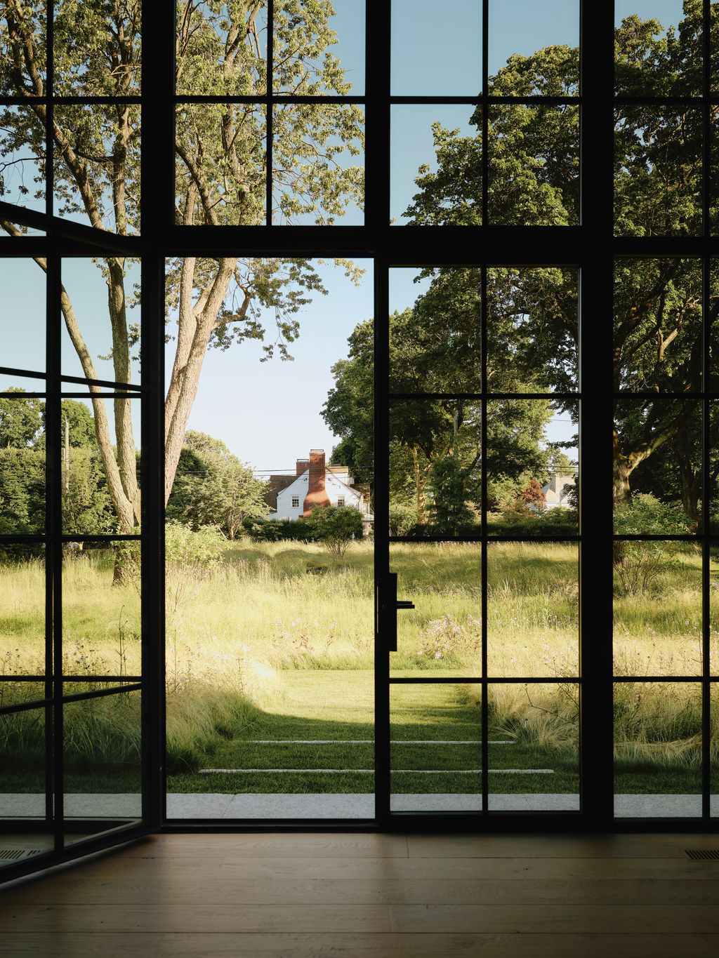 Image may contain Grass Plant Vegetation Tree Window Door French Window Oak Nature Outdoors Park and Gate
