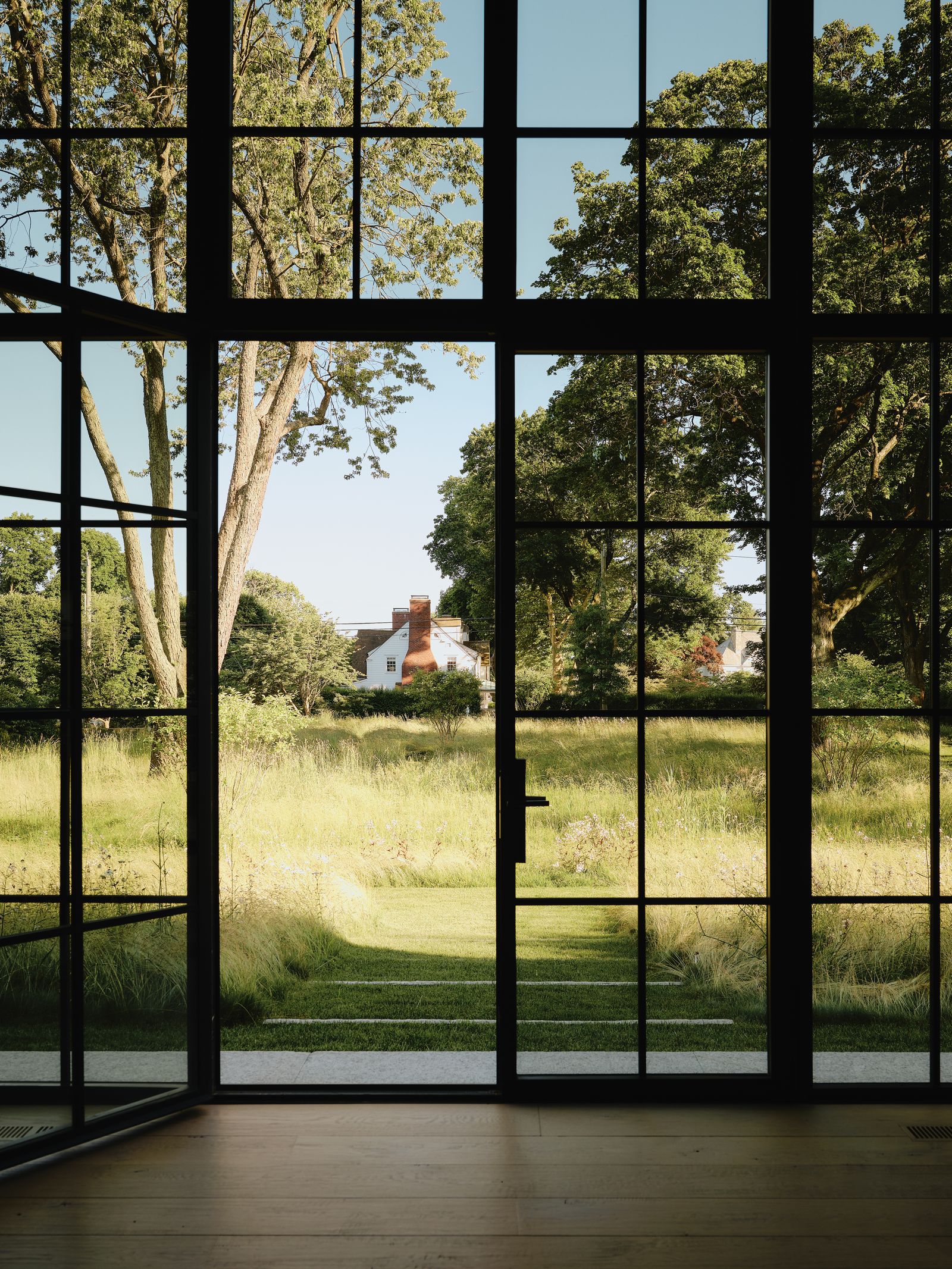 Image may contain Grass Plant Vegetation Tree Window Door French Window Oak Nature Outdoors Park and Gate