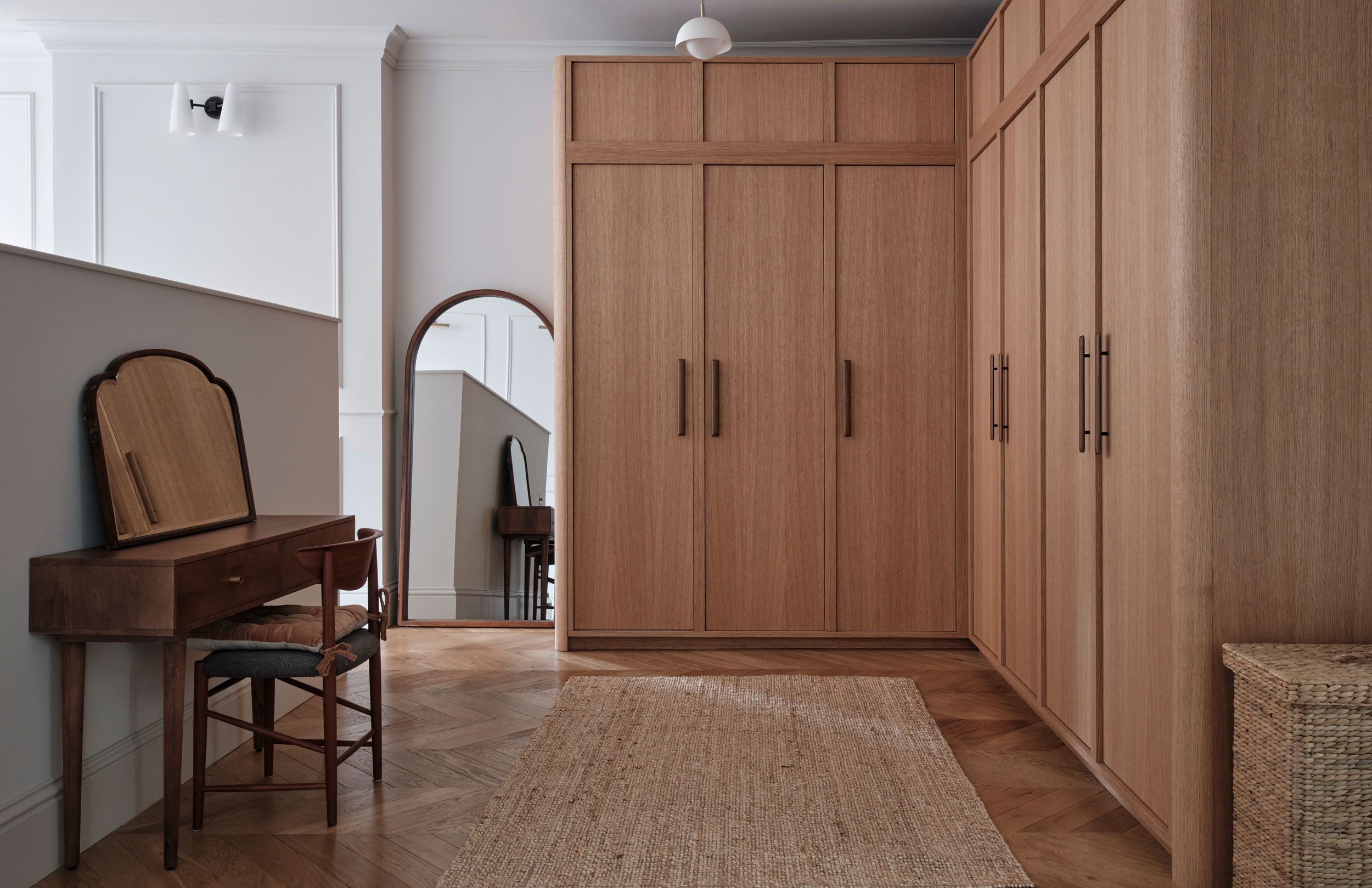 Image may contain: Indoors, Interior Design, Wood, Chair, Furniture, Home Decor, Rug, Floor, Flooring, Desk, and Table