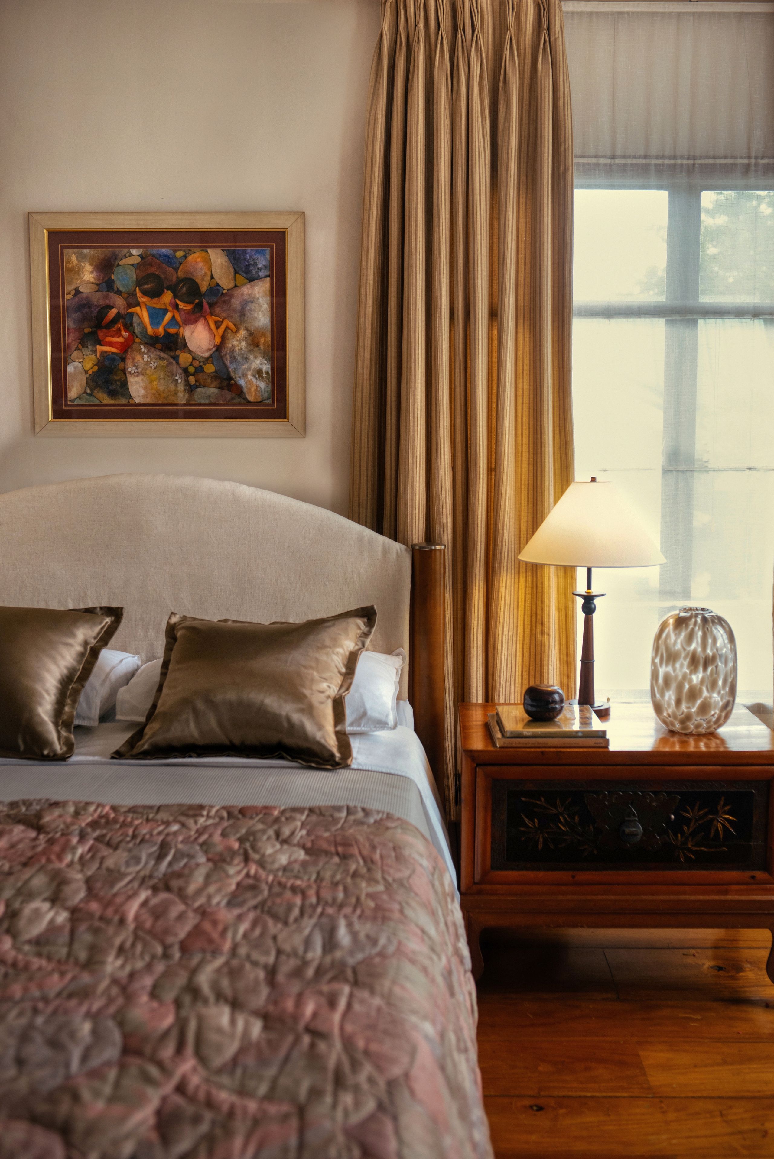 Image may contain: Cushion, Home Decor, Lamp, Indoors, Interior Design, Bed, Furniture, Table Lamp, Art, Painting, and Pillow