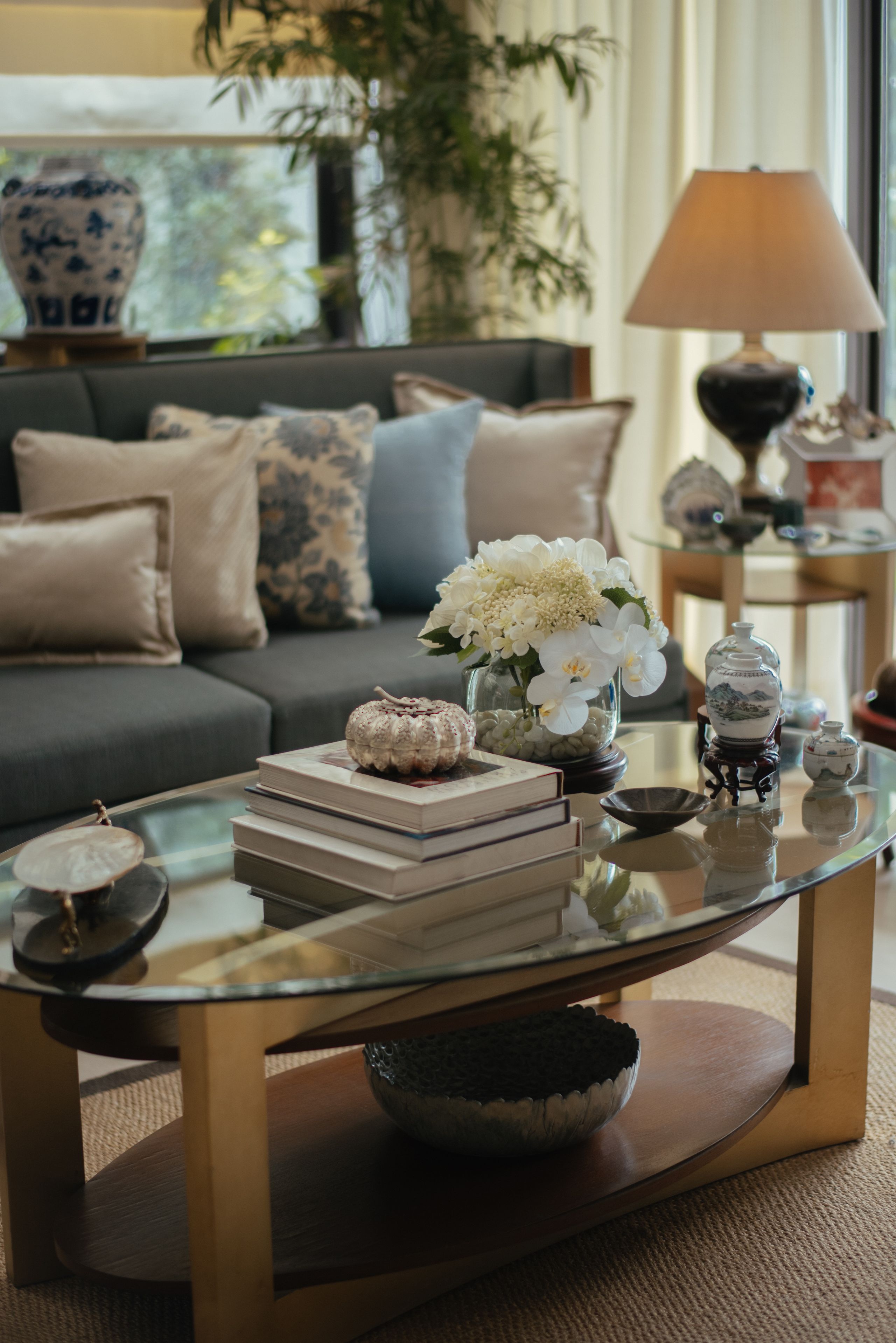 Image may contain: Coffee Table, Furniture, Table, Lamp, Tabletop, Desk, Home Decor, Architecture, Building, and Indoors