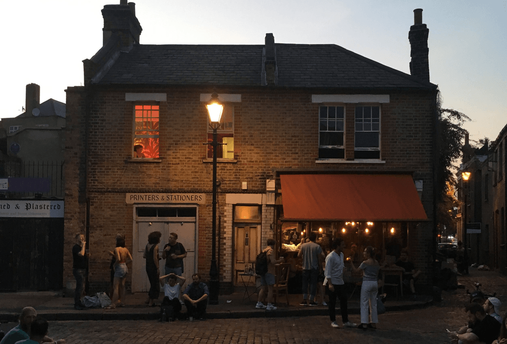 Image may contain City Road Street Urban Architecture Building Outdoors Shelter Neighborhood Person and Indoors