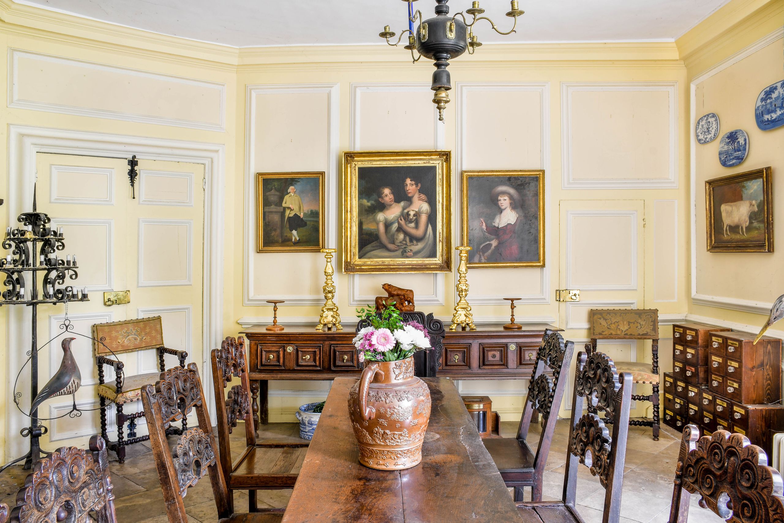 Image may contain: Architecture, Building, Dining Room, Dining Table, Furniture, Indoors, Room, Table, Lamp, and Chair