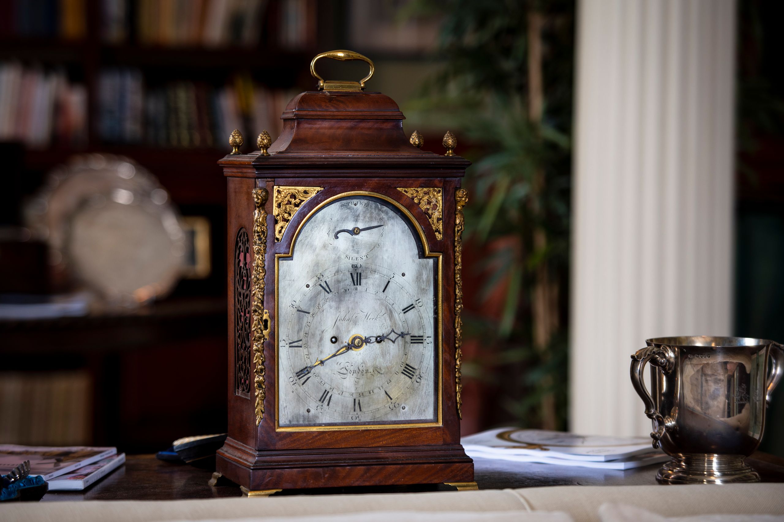 Image may contain: Alarm Clock, Clock, Cup, and Analog Clock