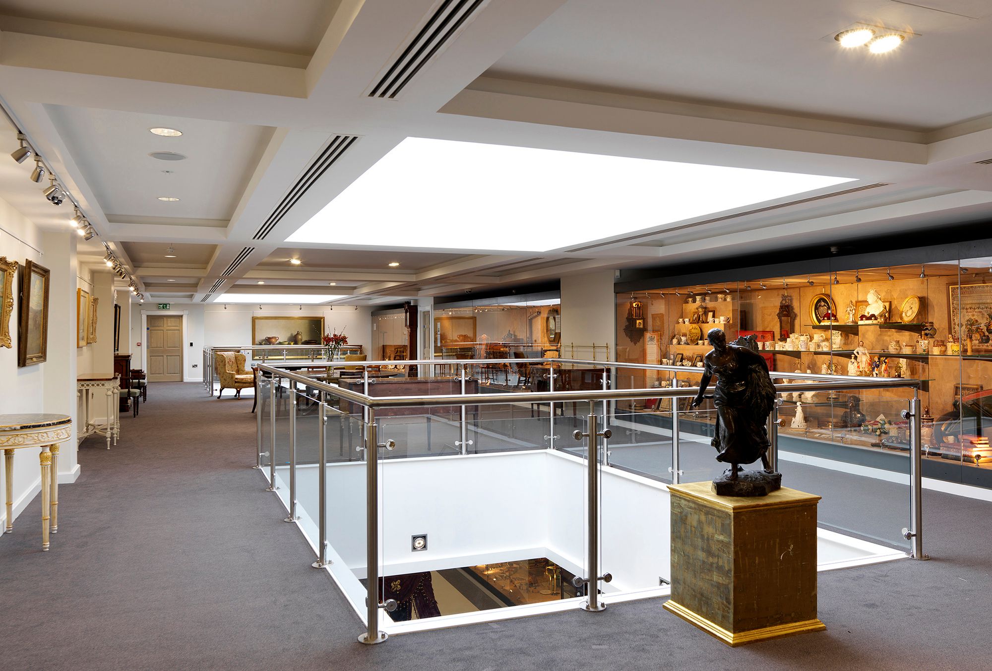 Image may contain: Architecture, Building, Indoors, Museum, Desk, Furniture, Table, Person, Art, Painting, and Chair