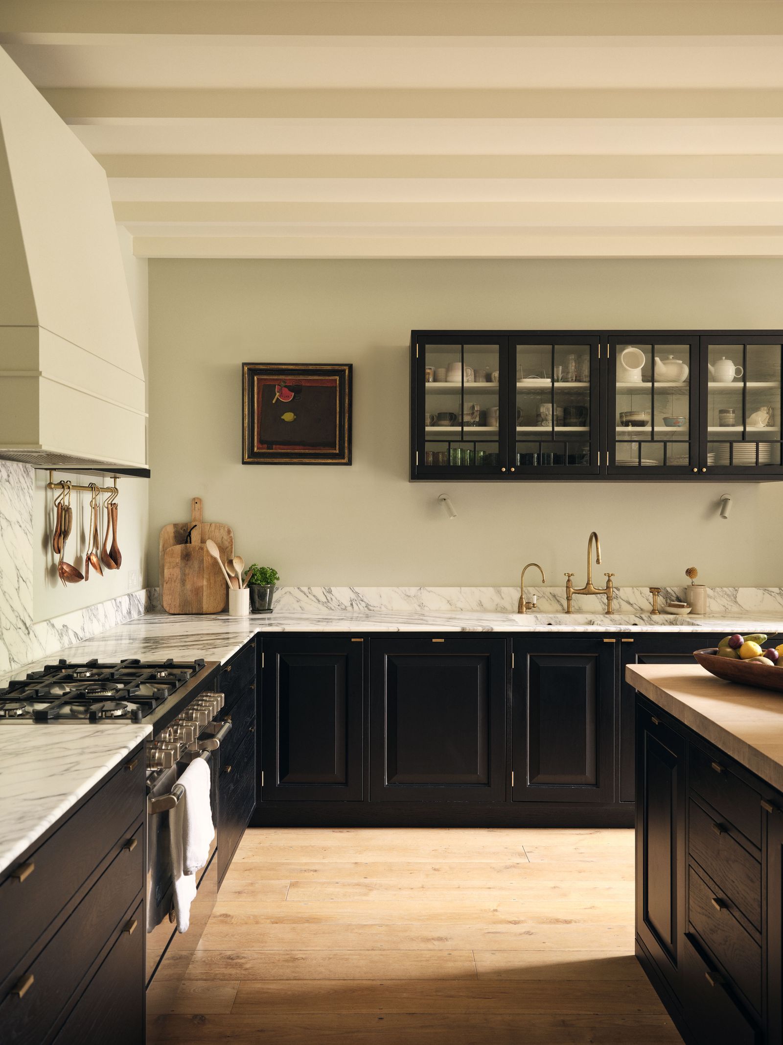 Image may contain Indoors Interior Design Kitchen Sink Sink Faucet Cooktop Plant and Cup