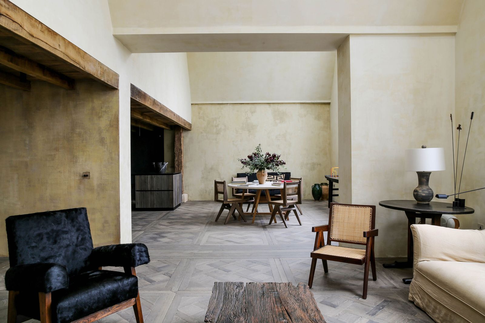 Image may contain Lamp Floor Chair Furniture Home Decor Couch Table Flooring Architecture Building and Indoors