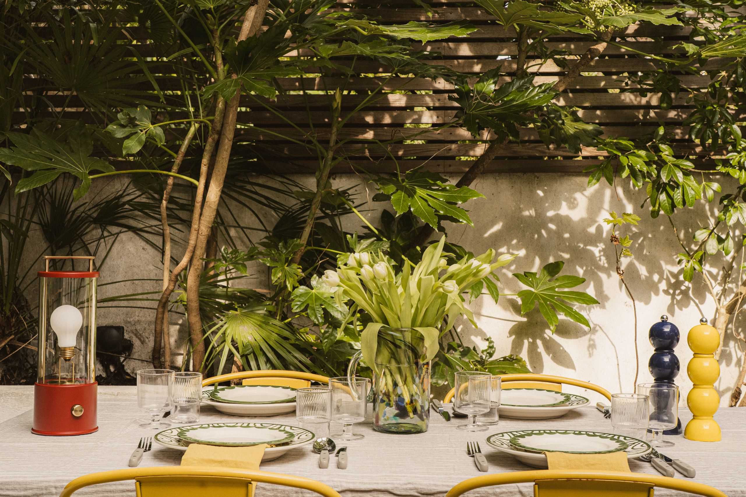 Image may contain: Furniture, Table, Dining Table, Cutlery, Fork, Plant, Potted Plant, Cup, Architecture, and Building