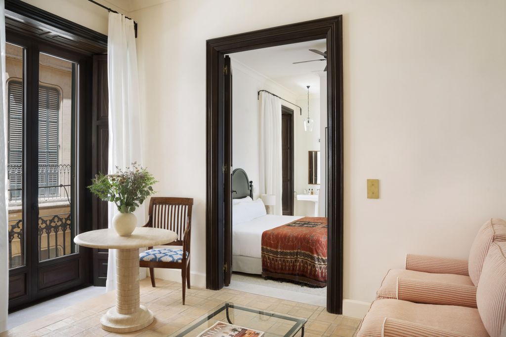 Image may contain Corner Chair Furniture Door Desk Table Bed Book Publication Home Decor and Indoors