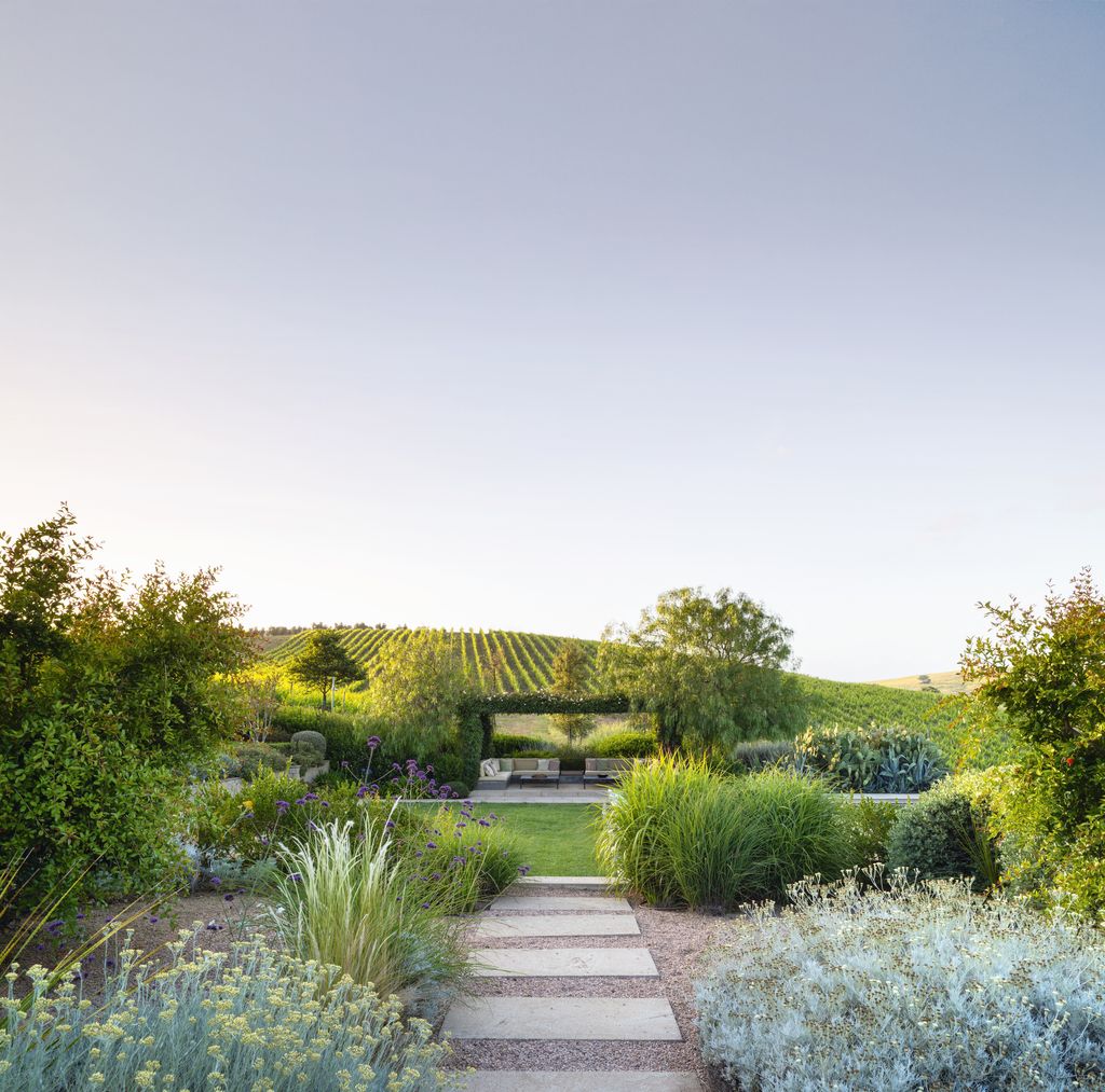 Image may contain Outdoors Nature Countryside Grass Plant Rural Garden Vegetation Sky Bench Furniture and Scenery