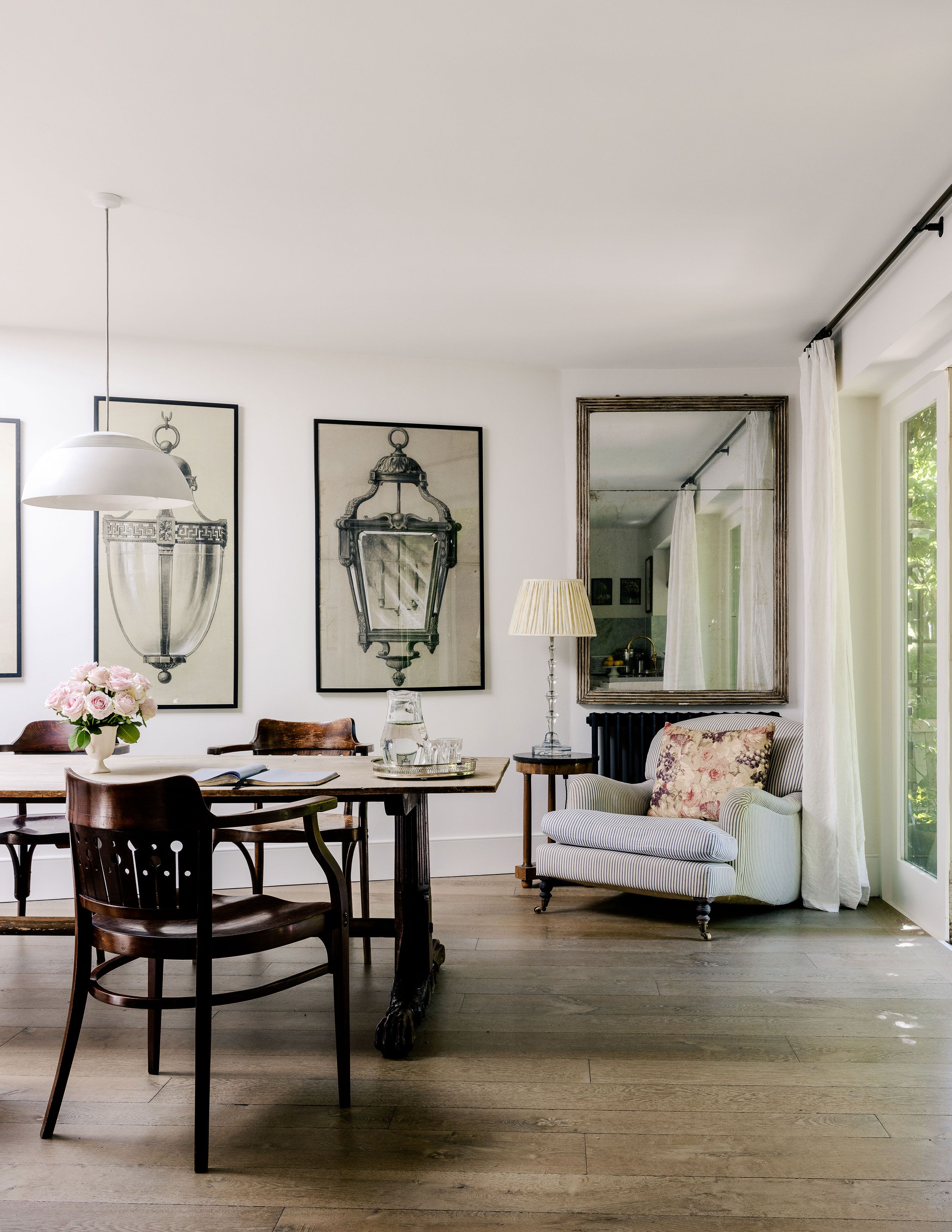 Image may contain: Architecture, Building, Dining Room, Dining Table, Furniture, Indoors, Room, Table, and Lamp