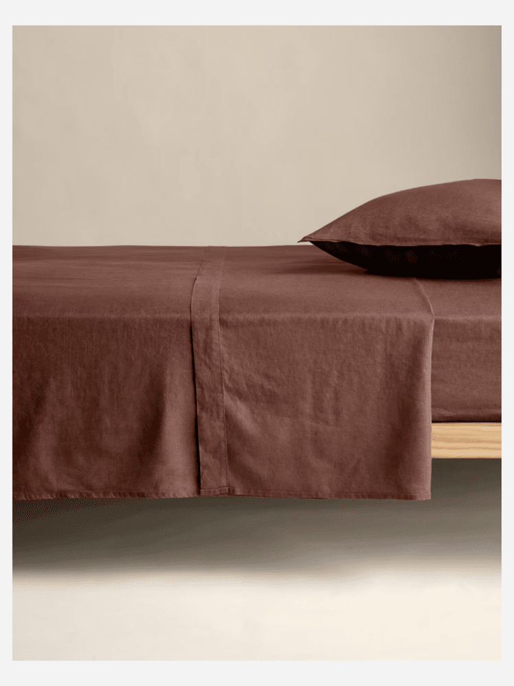 Image may contain: Home Decor, Cushion, Bed, and Furniture