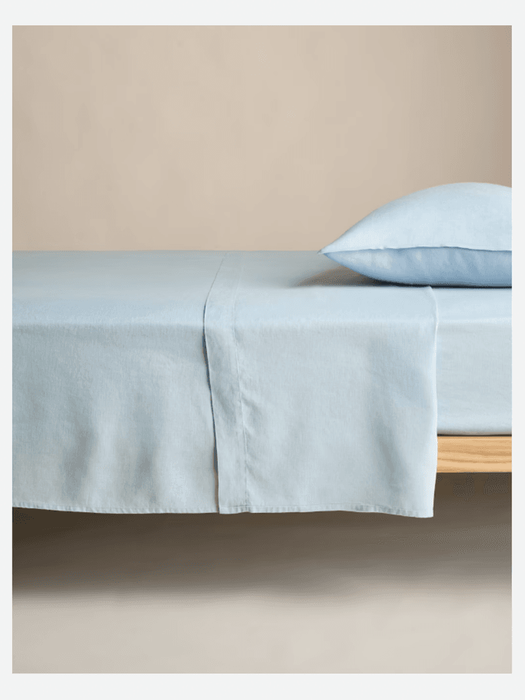 Image may contain: Home Decor, Linen, Cushion, Furniture, and Bed