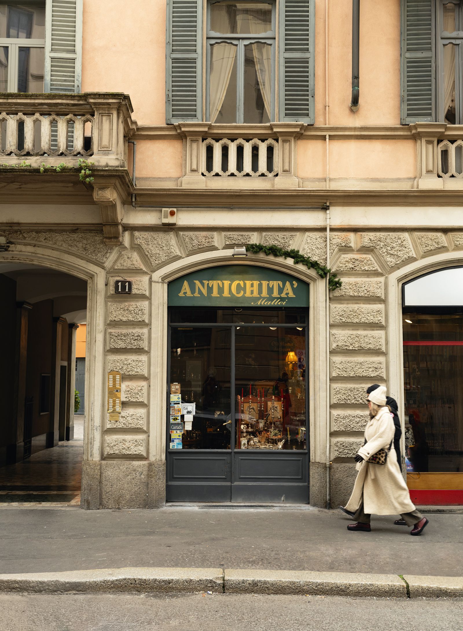 Image may contain Clothing Coat City Footwear Shoe Adult Person Accessories Bag Handbag Urban Road and Street