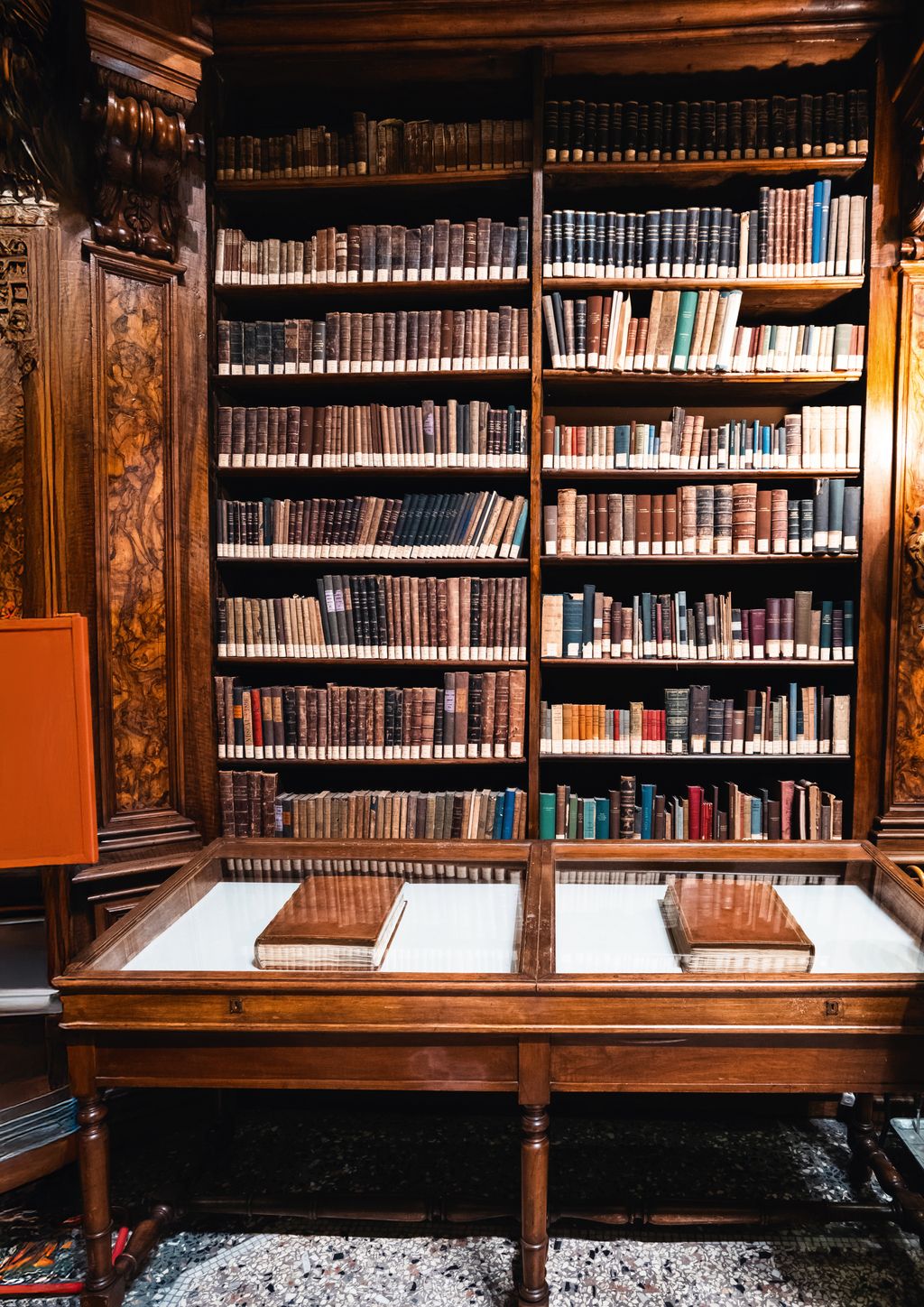 Image may contain Furniture Bookcase Hardwood Stained Wood Wood Book Publication Desk and Table