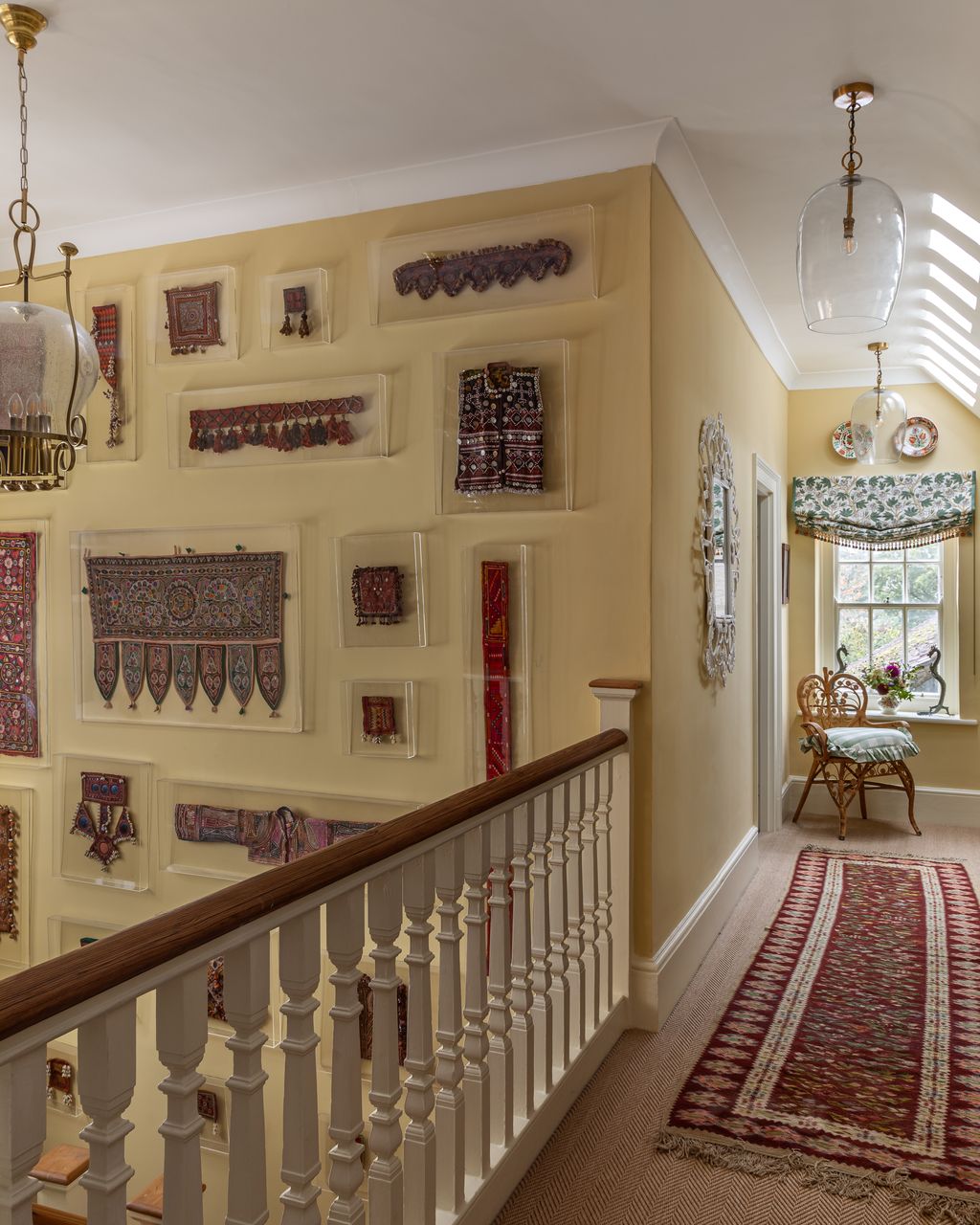 Image may contain Home Decor Lamp Indoors Rug Architecture Building Foyer Chair Furniture House and Housing