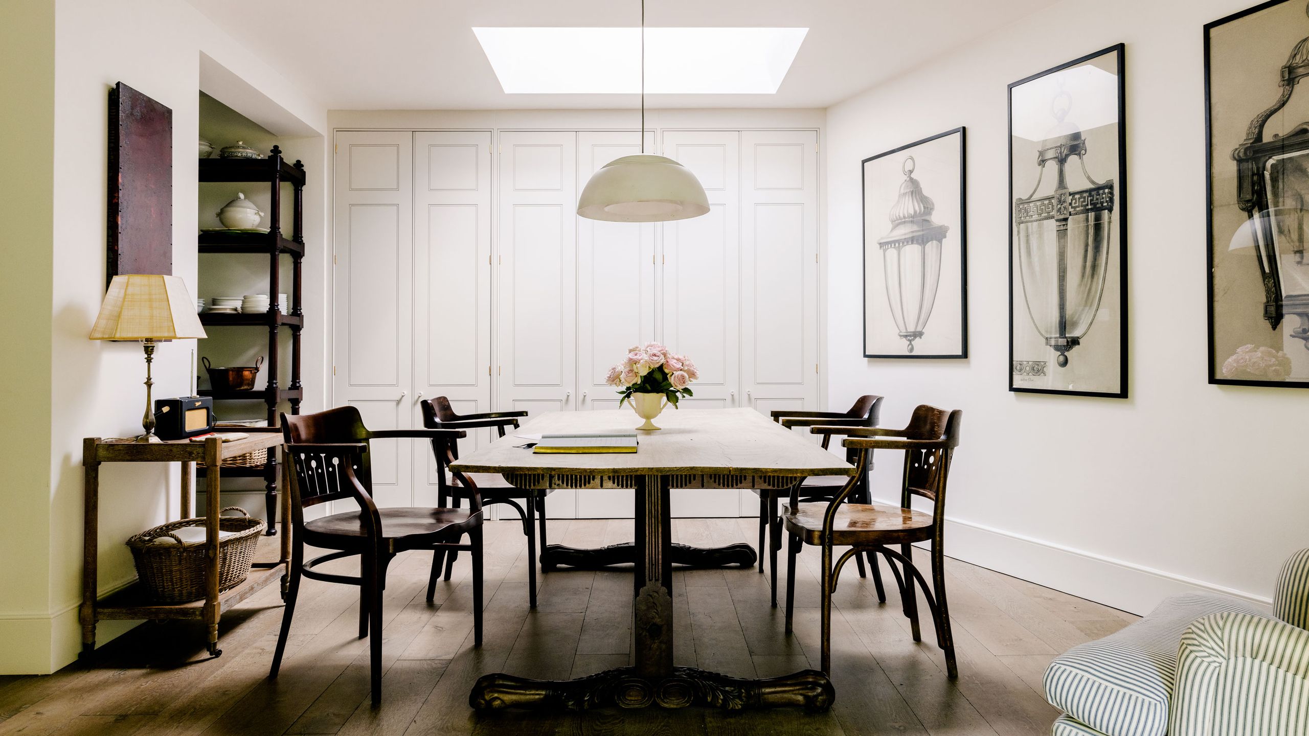 Image may contain: Architecture, Building, Dining Room, Dining Table, Furniture, Indoors, Room, Table, Chair, Lamp, and Desk