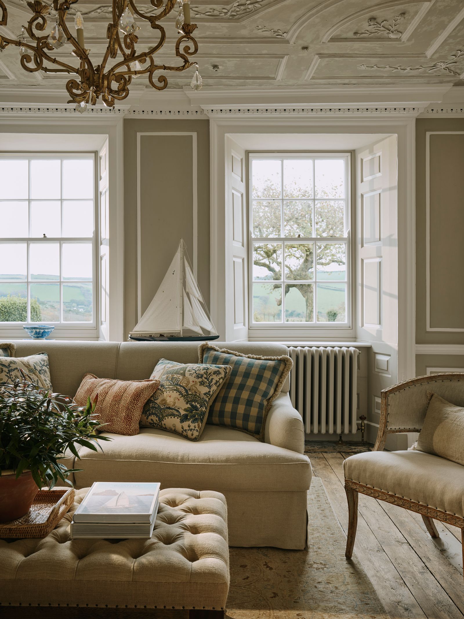 Image may contain Lamp Couch Furniture Plant Chair Window Boat Transportation Vehicle Home Decor and Candle