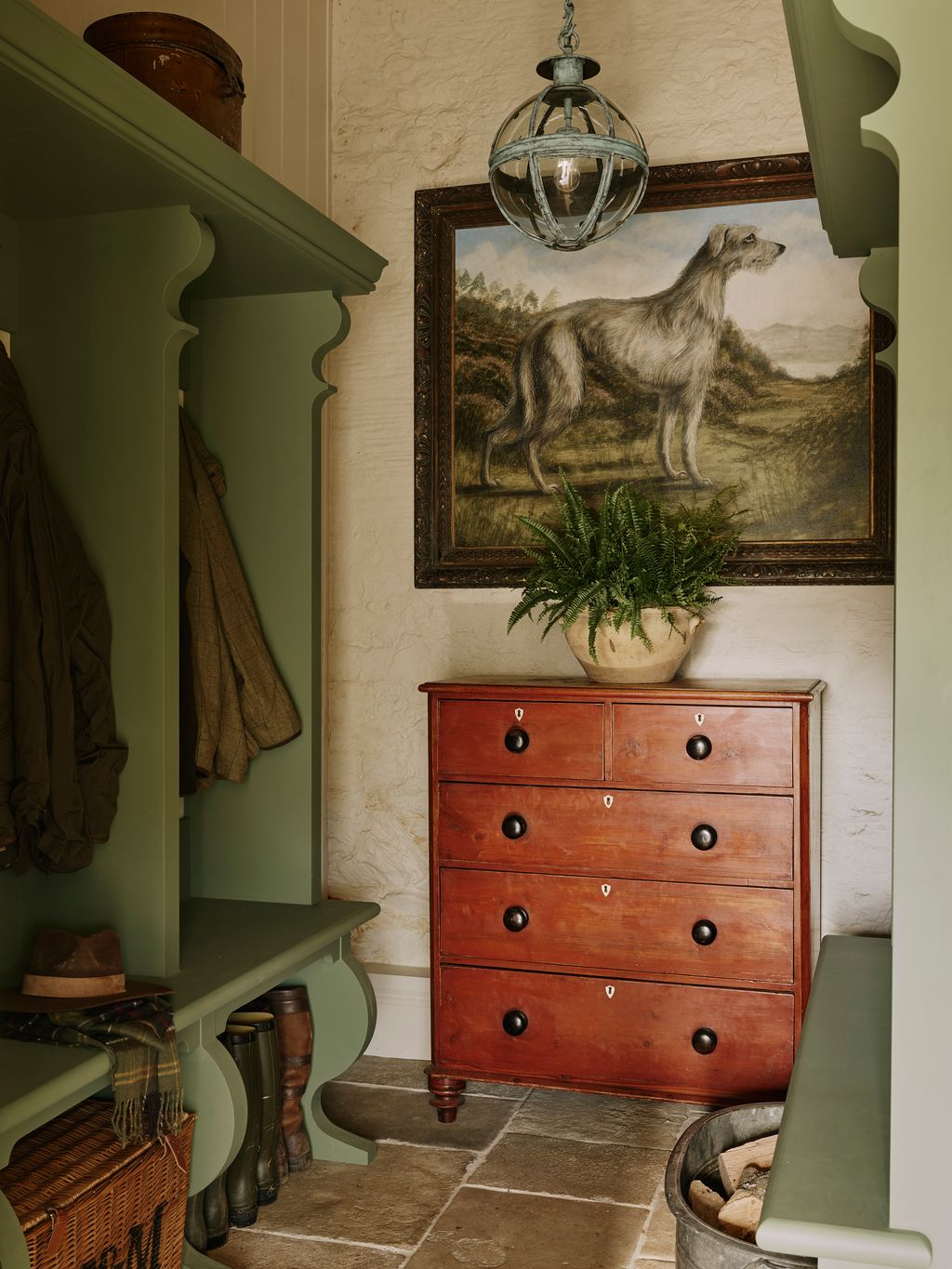 Image may contain Lamp Plant Furniture Art Painting Animal Canine Dog Mammal Pet Cabinet Clothing and Hat