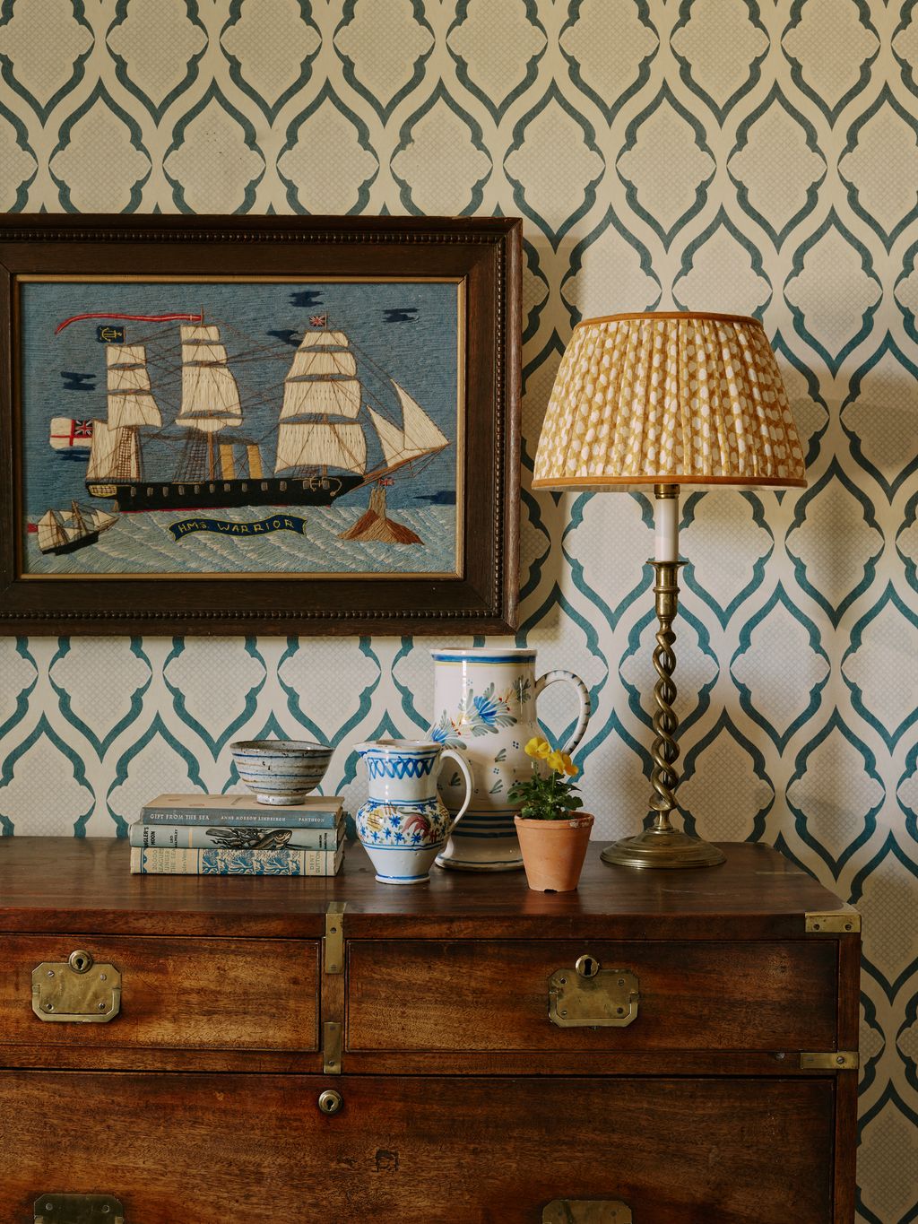 Image may contain Lamp Art Painting Cabinet Furniture Table Lamp Drawer Cup Indoors Interior Design and Sideboard